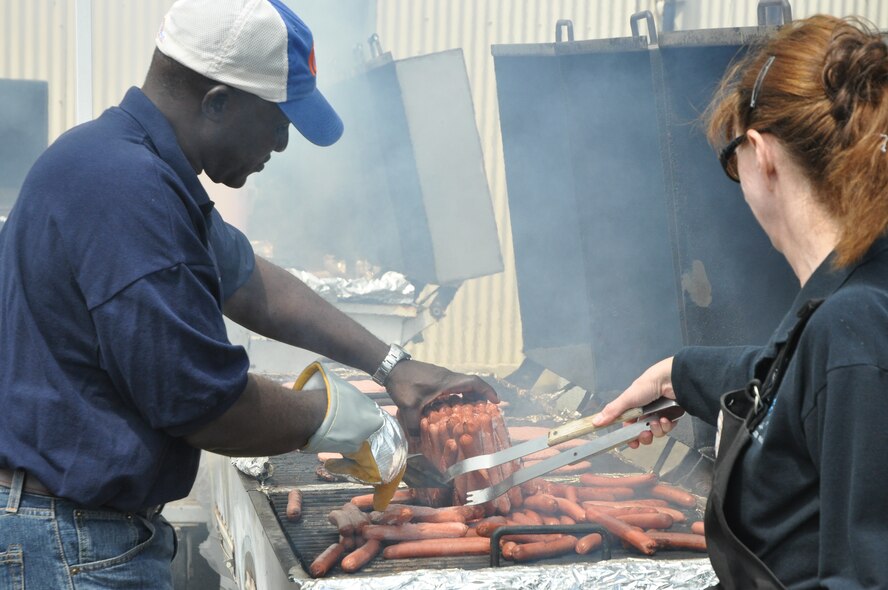 Chief Master Sgt. Stephen Nnodim, 940th Civil Engineering Squadron, and Chief Master Sgt. Mary Chiapelli, 940th Force Support Squadron, tend the grill at the 940th Wing annual picnic, June 5, 2011, at Beale Air Force Base, Calif.  Traditionally, the unit's chief master sergeants man the barbeque at the annual event. (U.S. Air Force photo by Senior Airman Adam Hamar/Released)  