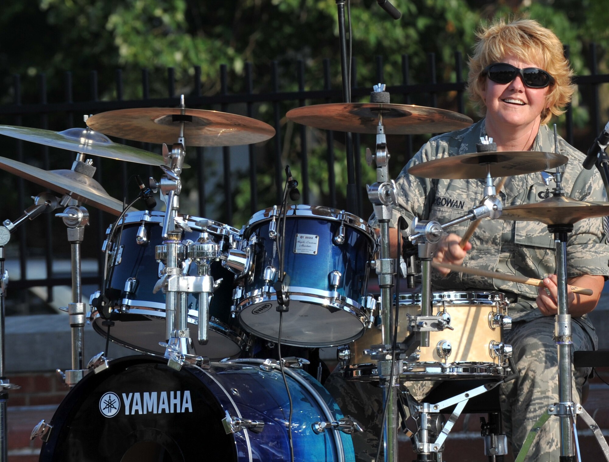 Staff Sgt. Christi McGowan jams out on the drums during the United States Band of Mid-America's Starlifter concert at Scott AFB June 5, 2011.  The performance was the summer series kick-off event.  Upcoming performances in the summer concert series include a Wisconsin Tour, June 30- July 2. (U.S. Air Force photo/ Airman 1st Class Divine Cox)