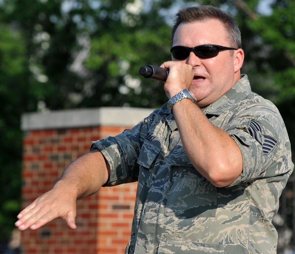 Tech Sgt. James Gilley rocks out during his performance at the United States Band of Mid-America's Starlifter concert at Scott AFB June 5, 2011.  The performance was the summer series kick-off event.  Upcoming performances in the summer concert series include a Wisconsin Tour, June 30- July 2. (U.S. Air Force photo/ Airman 1st Class Divine Cox)