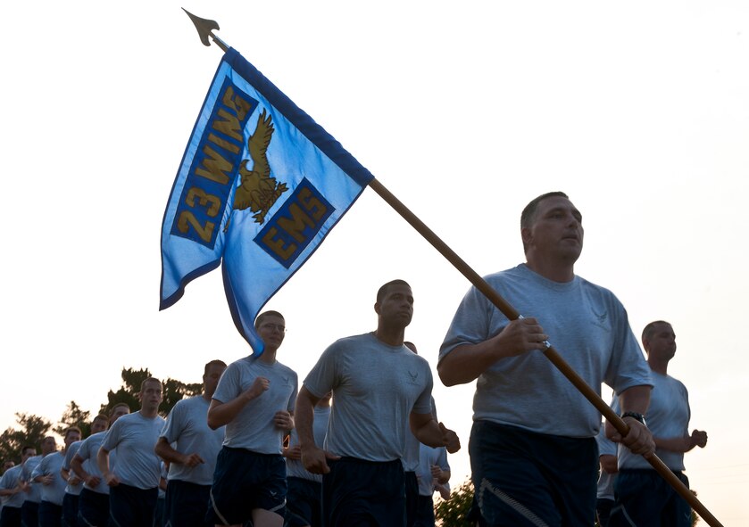 Airmen from the 23rd Equipment Maintenance Squadron ran in formation during a 1.5 mile morale run at Moody Air Force Base, Ga. June 3. The 23rd Maintenance Group held a sports day for all their squadrons and kicked the event off with a 1.5-mile run to Mission Lake to help boost camaraderie. (U.S. Air Force photo/Senior Airman Benjamin Wiseman)(RELEASED)

