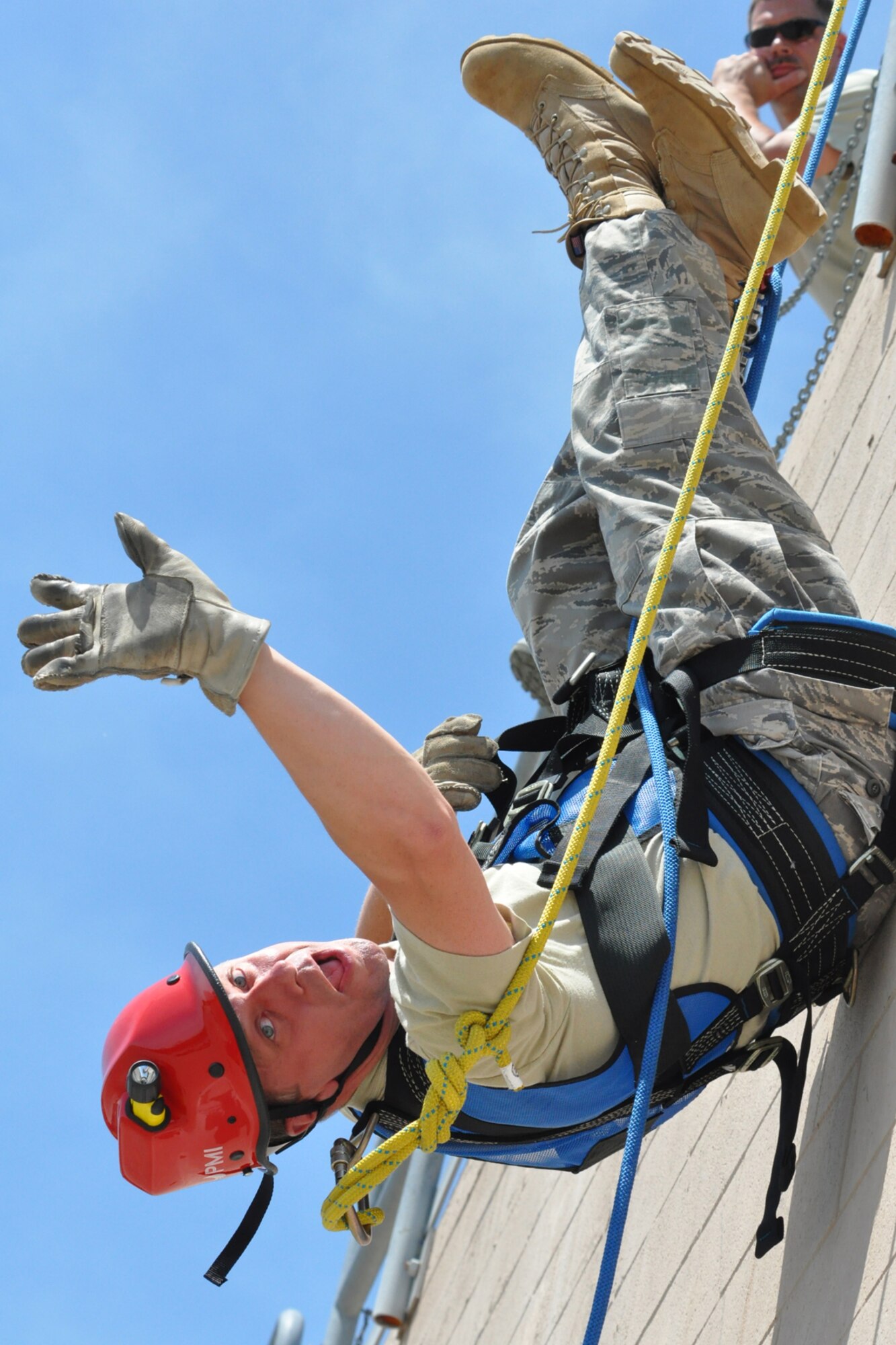 YOUNGSTOWN AIR RESERVE STATION, Ohio -- Air Force Reserve Lt. Col. William Kowalewski, commander of the 910th Civil Engineer Squadron, rappels from a building during an exercise at the fire training compound commonly known as the burn pit here, June 6, 2011. This training is part of requirements that keep the 910th firefighters combat ready. U.S. Air Force photo by Senior Airman Megan Tomkins