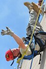 YOUNGSTOWN AIR RESERVE STATION, Ohio -- Air Force Reserve Lt. Col. William Kowalewski, commander of the 910th Civil Engineer Squadron, rappels from a building during an exercise at the fire training compound commonly known as the burn pit here, June 6, 2011. This training is part of requirements that keep the 910th firefighters combat ready. U.S. Air Force photo by Senior Airman Megan Tomkins