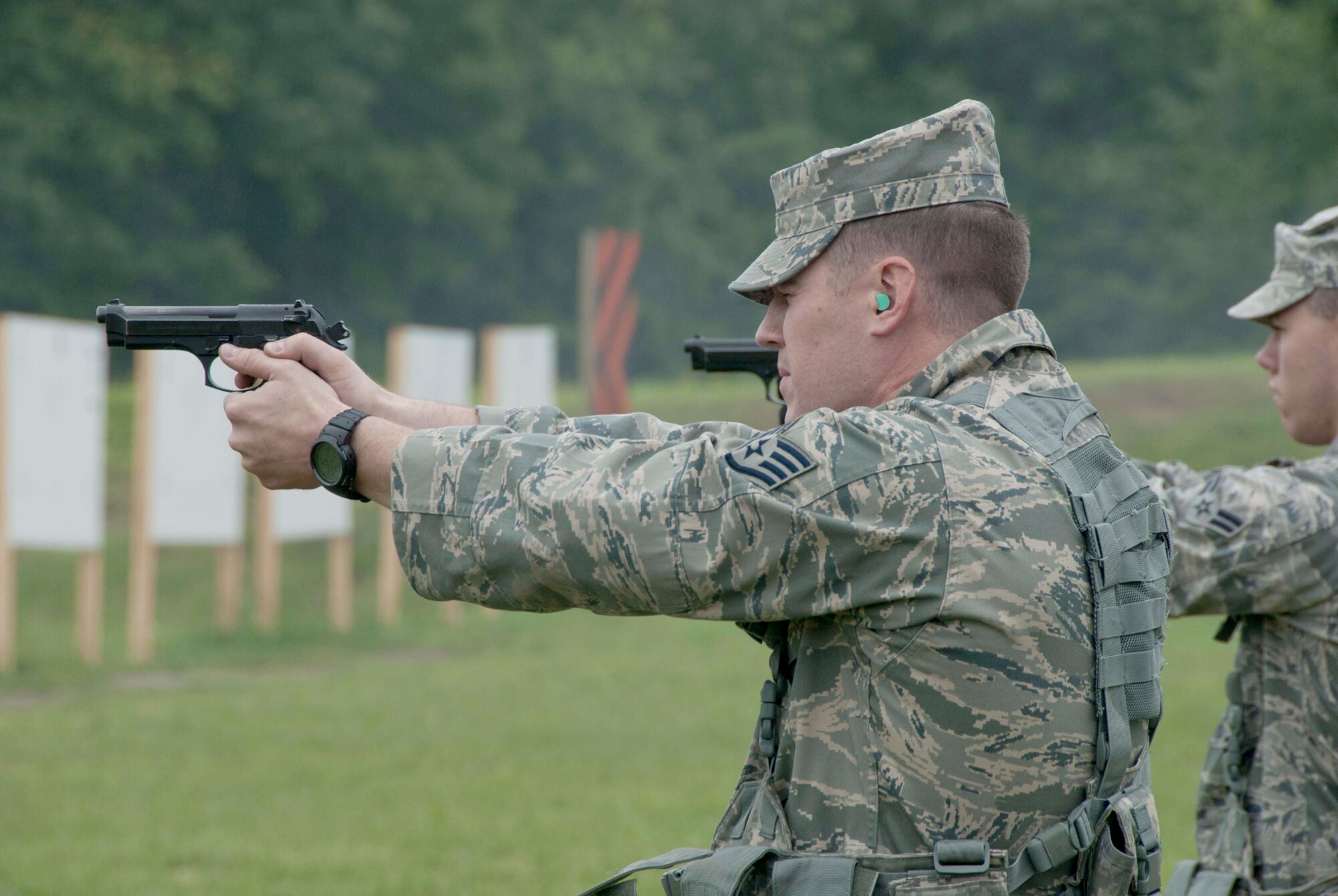 Staff Sergeant Aaron Webb fires the Beretta M9 as part of his requalification May 16, 2011, at Arnold Air Force Base, Tenn. Sergeant Webb is assigned to the 134th Security Forces Squadron. (U.S. Air Force photo/Staff Sergeant Scott Hollis)