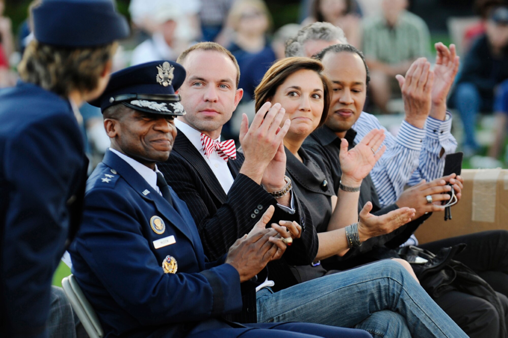 From right to left, Maj. Gen. Darren W. McDew, commander, Air Force District of Washington, Wesley Whatley, director of the band program for Macy’s Day Parade, Amy Quell, Macy Day Parade executive producer, Orland Veris, Macy’s media relations representative, and Robin Hall, senior vice president of the Macy’s Parade and entertainment group, applaud the U.S. Air Force Band’s Summer Concert Series, June 4, at The Air Force Memorial, Arlington, Va. The concert kicked off with the Macy’s Day Parade committee inviting the USAF Band and the USAF Honor Guard to participate in the 2012 Macy's Day Parade. (U.S. Air Force photo by Staff Sgt. Raymond Mills)