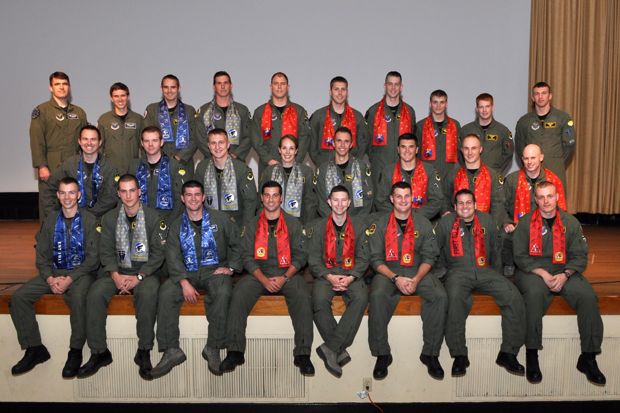 Class 10-04 of the Formal Training Unit pose for a class photo after graduation ceremonies in Hoban Hall at Barksdale Air Force Base, La., June 4, 2011. Graduates of the 93rd Bomb Squadron's FTU covered several aspects of B-52H Stratofortress operations during their training, which lasted approximately two years. The FTU is in charge of training Airmen to fly the B-52.  To accomplish this task of forging new aviators into Combat Ready B-52 crewmembers takes the work of both AF Reserve and Active Duty Members. The graduates from Class 10-04 will now report for duty to squadrons throughout the B-52 community. (U.S. Air Force photo/Tech. Sgt. Jeff Walston)
