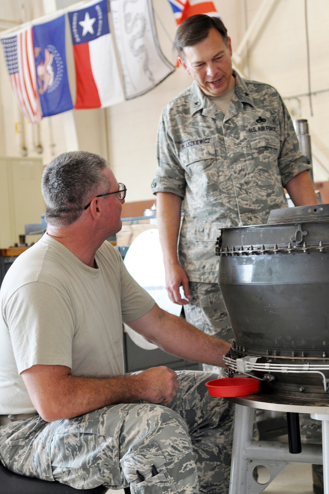 Brig. Gen. Gary Blaszkiewicz, the director of logistics for Air Force Reserve Command, listens as Tech. Sgt. Richard Murchison with the Propulsion Shop explains how he is installing thermocouples into the transition case at Barksdale Air Force Base, La., June 4, 2011. Thermocouples are the inner turbine temperature probes that provide the pilot critical instrument engine temperature and performance data. General Blaszkiewicz was at Barksdale for a familiarization visit to the 307th Bomb Wing and 917th Fighter Group. (U.S Air Force photo by Master Sgt. Mary Hinson)