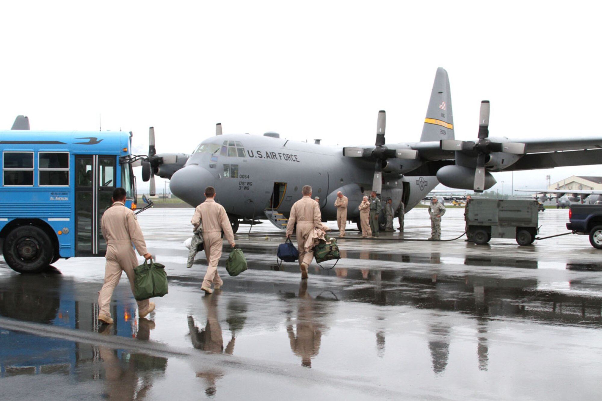 Airmen of the Alaska Air National Guard?s 176th Wing board one of two C-130?s prior to departure from Joint Base Elmendorf-Richardson, Wednesday, to begin a three-month deployment to Afghanistan. (U.S. Air Force photo/Senior Airman Christopher Gross)