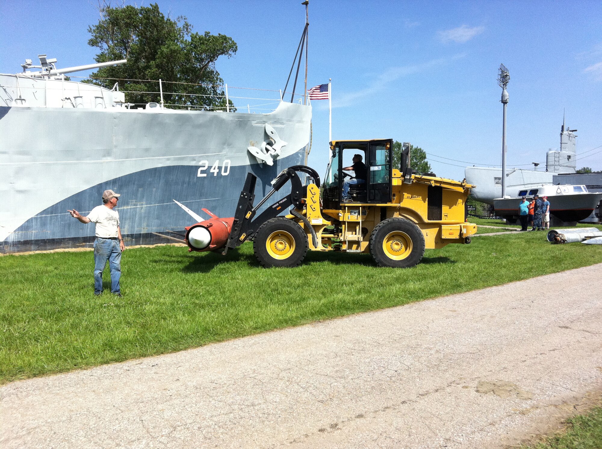 OMAHA, Neb. -- Dale Harris and Larry Simbro, heavy equipment operators with the 55th Logistics Readiness Squadron, move items out of oncoming flood waters at Freedom Park here June 1. Freedom Park is an outdoor museum that features numerous military exhibits and has been overcome by rising waters of the Missouri River. Four members of the 55th LRS joined with other members of Team Offutt to move museum artifacts to higher ground until the flood waters recede. (U.S. Air Force photo by Maj. Melvin Maxwell)