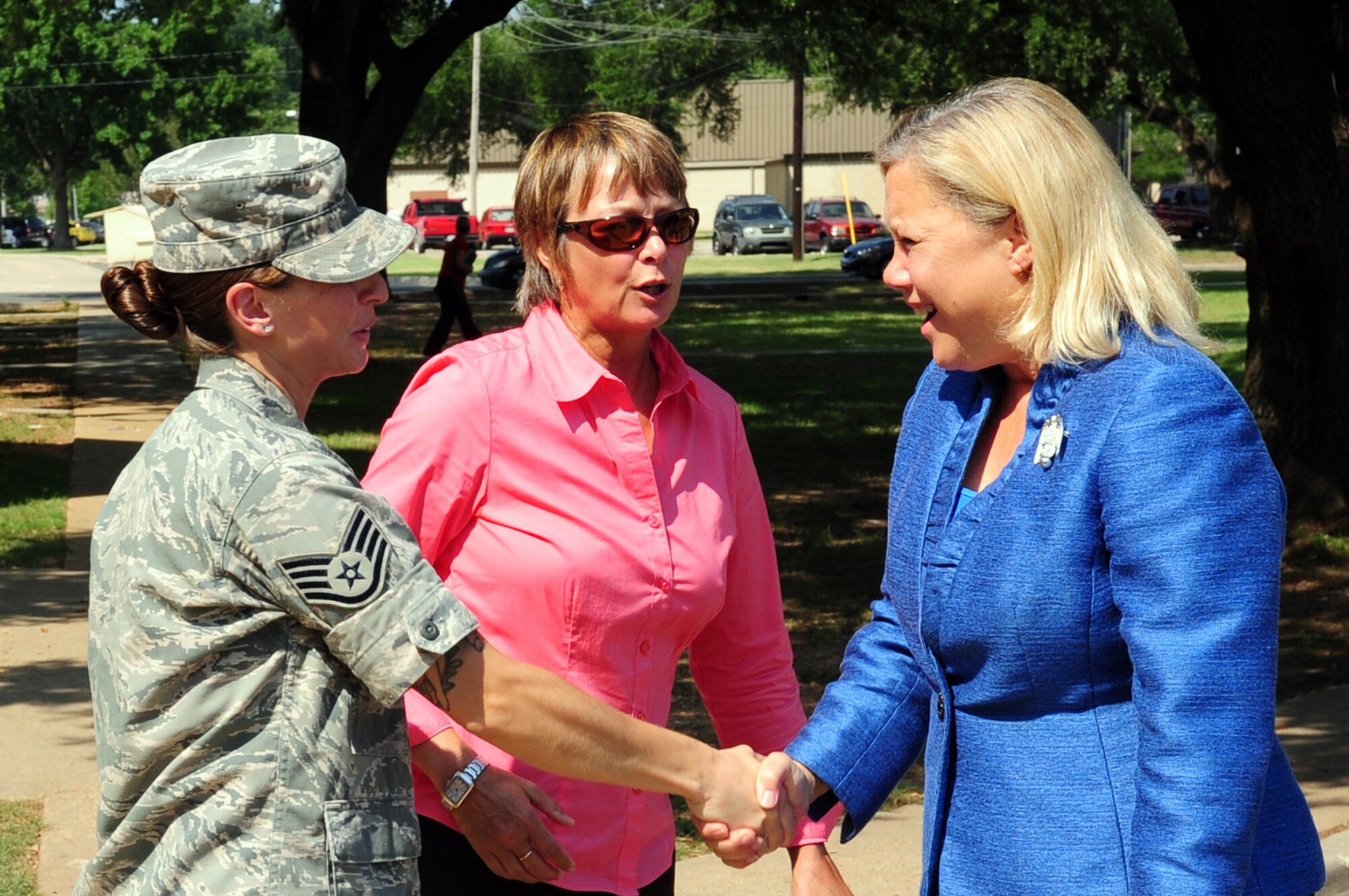 Louisiana Sen. Mary Landrieu (right) greets Staff Sgt. Kimberly Cooper, 2nd Civil Engineer Squadron dorm manager, and Suzanne Landry, 2 CES asset management site chief, outside enlisted dormitories located on Barksdale Air Force Base, La., June 2. During her multi-stop tour of Louisiana military installations, the senator focused on quality-of-life issues such as enlisted dormitories, base housing, education and energy efficiency of base facilities. (U.S. Air Force photo/Senior Airman Joanna M. Kresge)