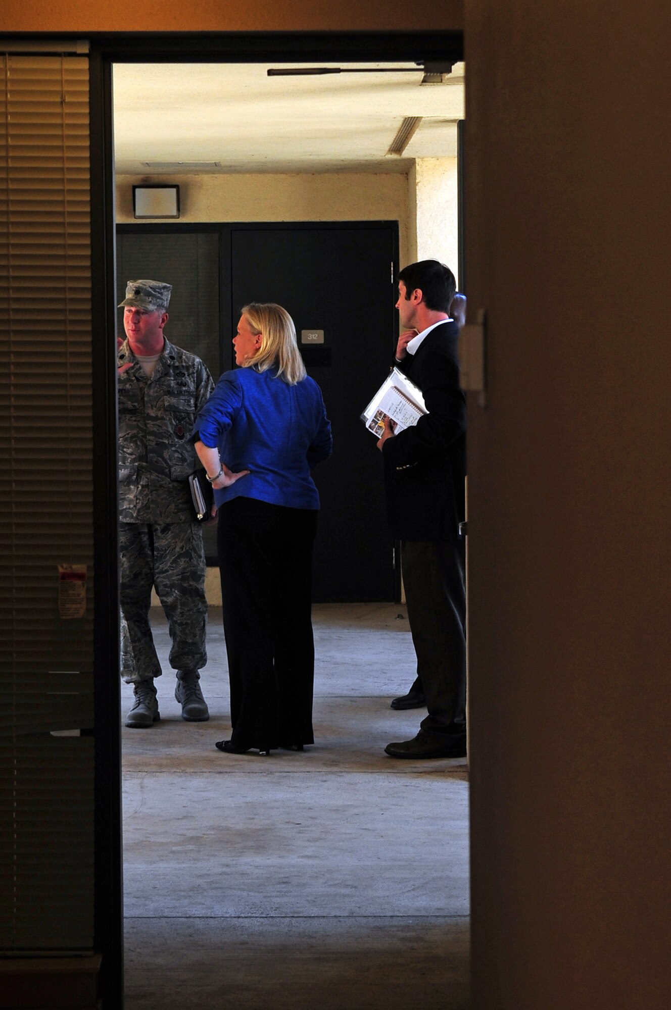 Louisiana Sen. Mary Landrieu discusses dorm conditions with members of base leadership upon exiting an enlisted dormitory located on Barksdale Air Force Base, La., June 2. During her multi-stop tour of Louisiana military installations, the senator focused on quality-of-life issues such as enlisted dormitories, base housing, education and energy efficiency of base facilities. (U.S. Air Force photo/Senior Airman Joanna M. Kresge)