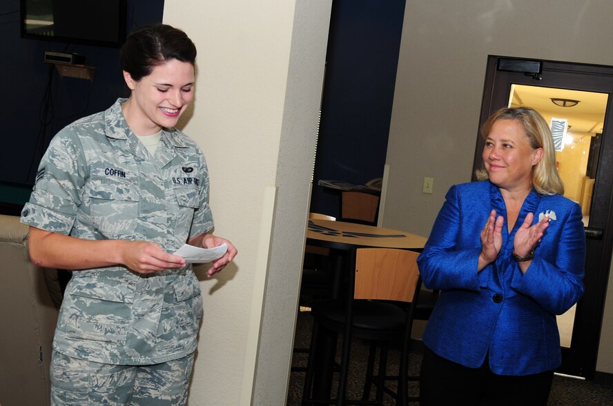 Louisiana Sen. Mary Landrieu applauds Senior Airman Jennifer Coffin, 2nd Contracting Squadron and Airman Against Drunk Driving president, for AADD’s 90 saves for 2011 in the enlisted dormitory blue room located on Barksdale Air Force Base, La., June 2. AADD offers Airmen a safe, reliable and anonymous ride home if their designated driver and other back-up plans fall through. Each save represents an Airman who was given a safe ride home by AADD instead of getting behind the wheel of a motor vehicle, endangering themselves and others. (U.S. Air Force photo/Senior Airman Joanna M. Kresge)