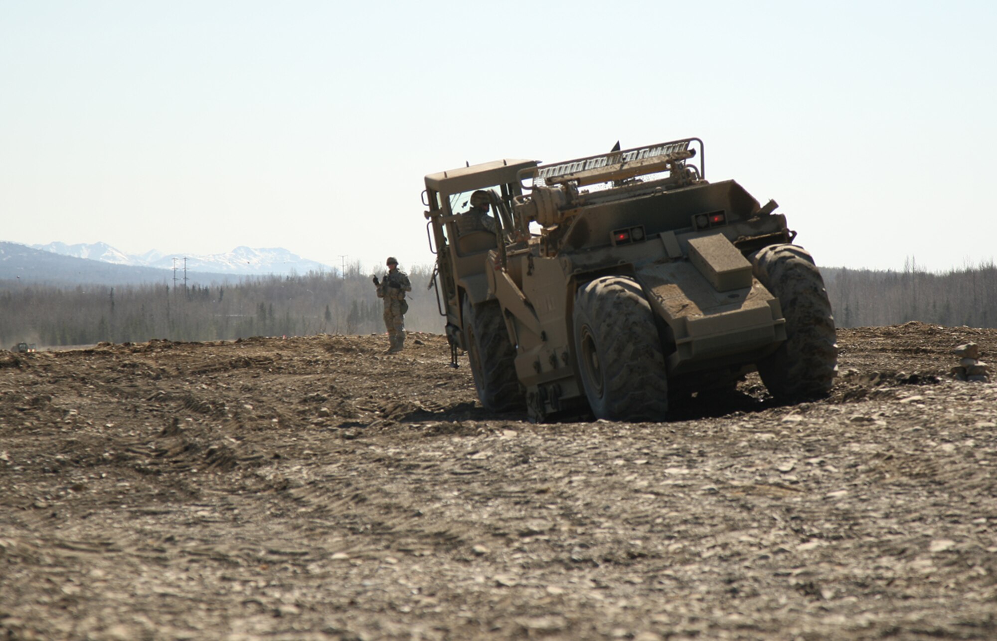 Soldiers of 84th Engineer Support Company dug up a 50 year-old concrete foundation at Camp Carroll, improved roadways at the Engineer Skills Training Area, and conducted terrain leveling operations at Bryant Army Airfield ? a project scheduled to continue for the next several months. (U.S. Air Force photo/Percy Jones)