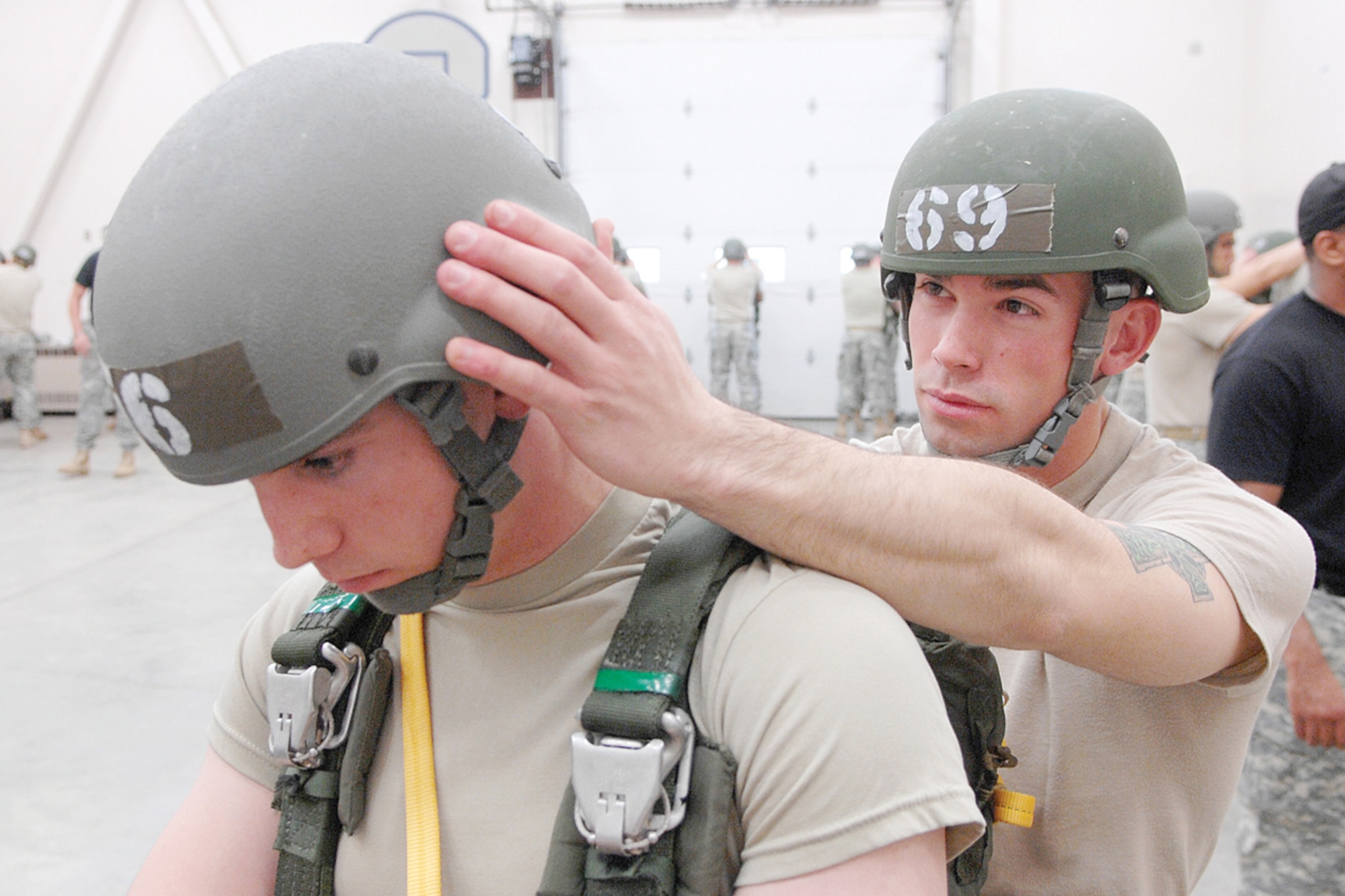 During a Jumpmaster Mobile Training Team course at Joint Base Elmendorf-Richardson, students learn to carefully inspect equipment worn by a military parachutist for any defect or abnormality whichmay cause the airborne equipment to fail. (Photo by Matthew Winstead/4-25th ABCT PA)