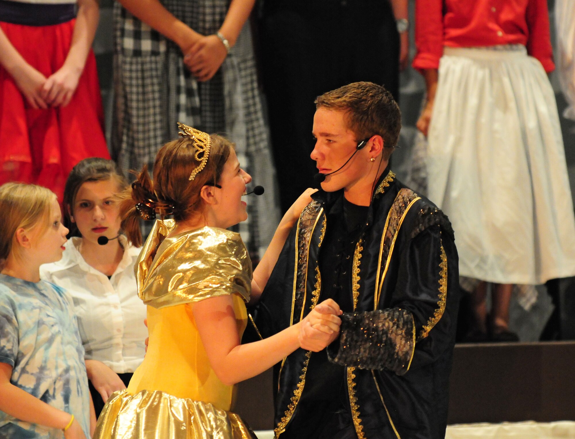 SPANGDAHLEM AIR BASE, Germany – Belle, played by Emma Frost, and the Prince, played by Brett Downey, dance during the finale of Spangdahlem Middle and Elementary Schools’ production of Disney’s Beauty and the Beast here June 4. The musical production was performed by the students for their families and the Saber community June 3-5. (U.S. Air Force photo/Airman 1st Class Matthew B. Fredericks)