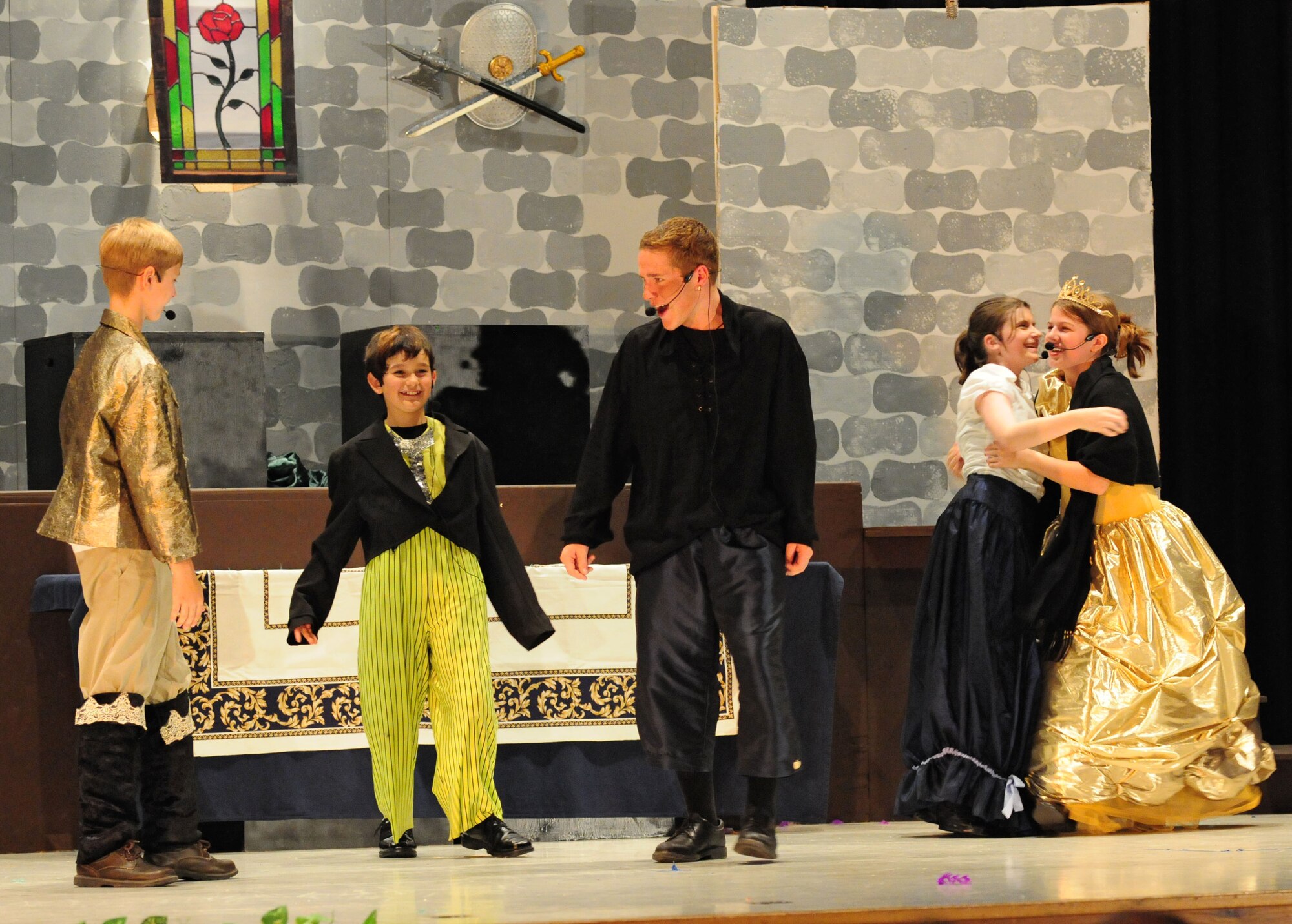 SPANGDAHLEM AIR BASE, Germany – Students perform a scene during Spangdahlem Middle and Elementary Schools’ production of Disney’s Beauty and the Beast here June 4. The musical production was performed by the students for their families and the Saber community June 3-5. (U.S. Air Force photo/Airman 1st Class Matthew B. Fredericks)