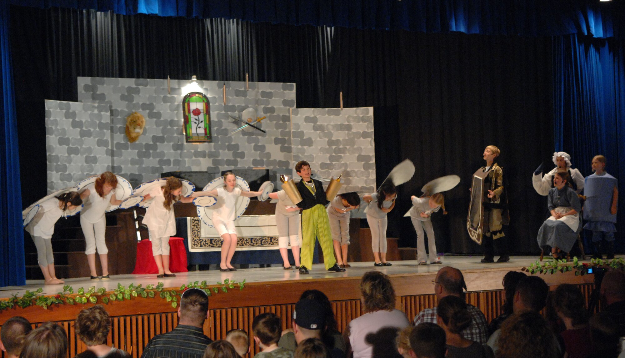 SPANGDAHLEM AIR BASE, Germany – Students perform the song “Be Our Guest” during Spangdahlem Middle and Elementary Schools’ production of Disney’s Beauty and the Beast here June 4. The musical production was performed by the students for their families and the Saber community June 3-5. (U.S. Air Force photo/Airman 1st Class Matthew B. Fredericks)