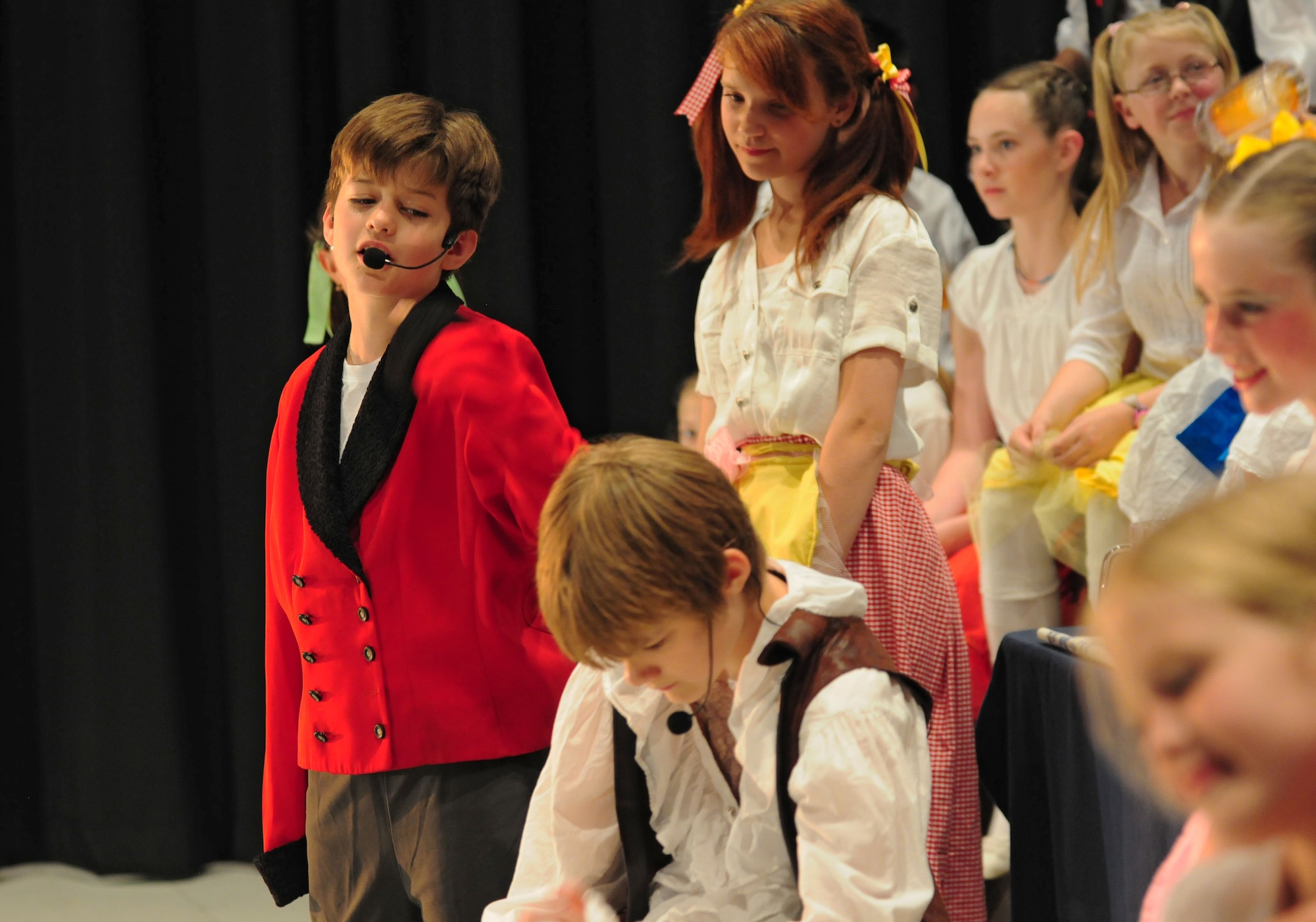 SPANGDAHLEM AIR BASE, Germany –LeFou, played by Will Frost, sings to Gaston, played by Alex Wrede, during Spangdahlem Middle and Elementary Schools’ production of Disney’s Beauty and the Beast here June 4. The musical production was performed by the students for their families and the Saber community June 3-5. (U.S. Air Force photo/Airman 1st Class Matthew B. Fredericks)