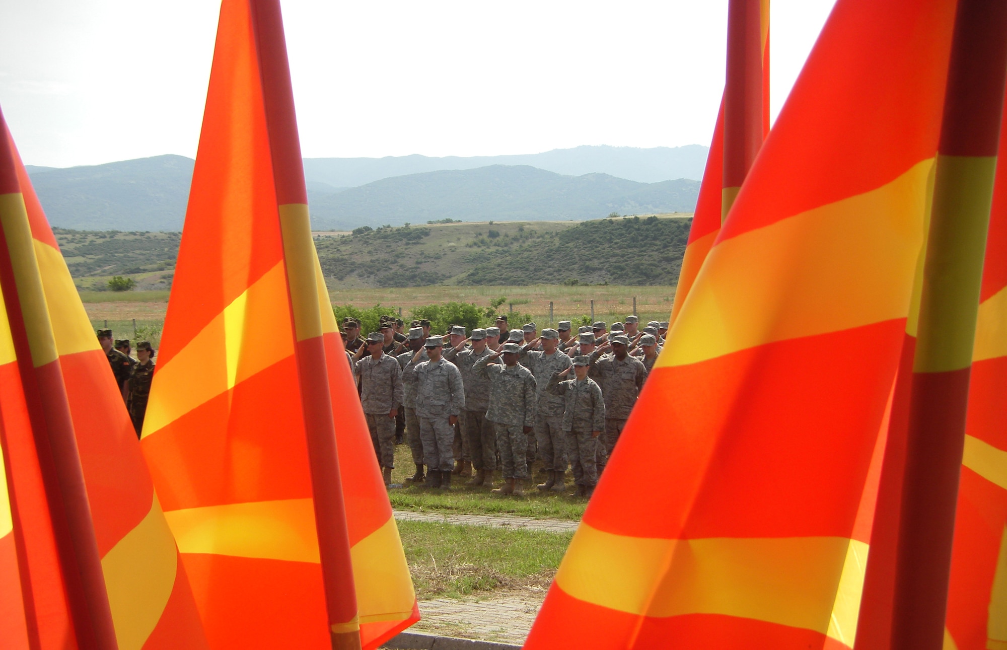 CAMP PEPELISHTE, Macedonia – Members of the United States Air Force and Army salute during the Medical Training Exercise in Central and Eastern Europe 2011 opening ceremony practice here June 6. The countries participating in this year’s MEDCEUR are Macedonia, Montenegro, Bosnia and Herzegovina, Serbia, Slovenia, Norway and the United States.  MEDCEUR is a Partnership for Peace and Chairman of the Joint Chiefs of Staff-sponsored regional and multilateral exercise in Central and Eastern Europe designed to provide medical training and operational experience in a deployed environment.  (U.S. Air Force photo/Master Sgt. Kelley J. Stewart)