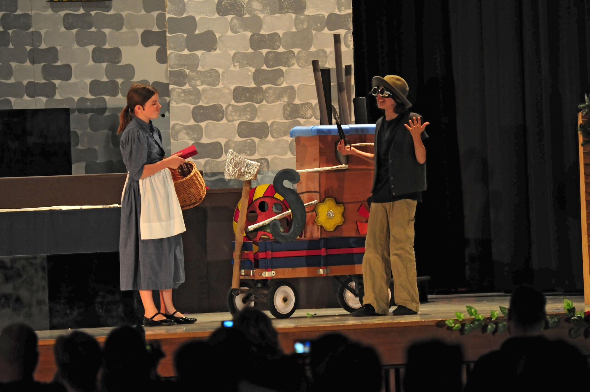 SPANGDAHLEM AIR BASE, Germany – Belle, played by Emma Frost, talks with her father, Maurice, played by David Buck, during Spangdahlem Middle and Elementary Schools’ production of Disney’s Beauty and the Beast here June 4. The musical production was performed by the students for their families and the Saber community June 3-5. (U.S. Air Force photo/Airman 1st Class Matthew B. Fredericks)