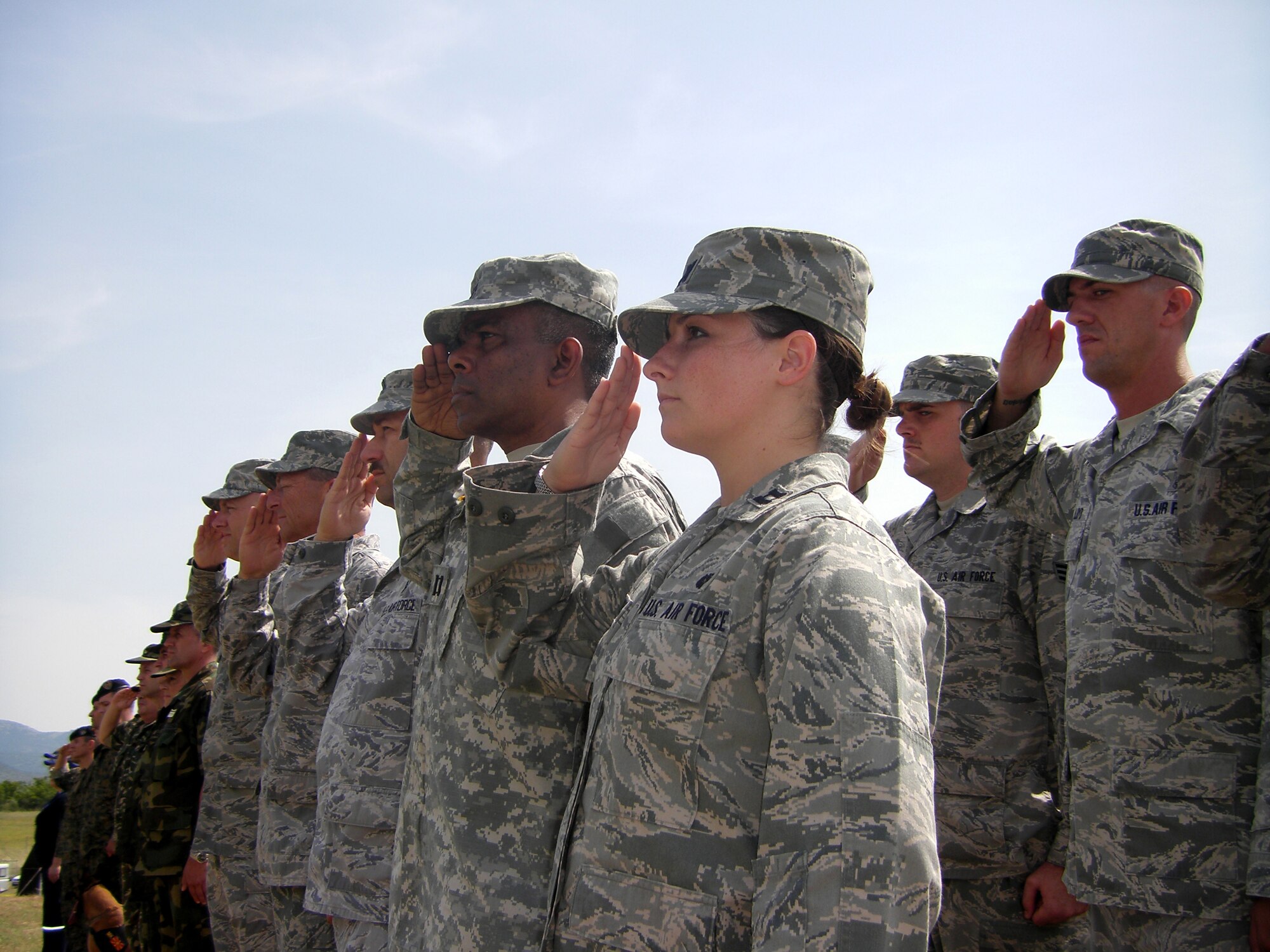 CAMP PEPELISHTE, Macedonia – Members of the United States Air Force and Army salute during the Macedonian and American National Anthems at the opening ceremony of Medical Training Exercise in Central and Eastern Europe 2011 here June 6.  The countries participating in this year’s MEDCEUR are Macedonia, Montenegro, Bosnia and Herzegovina, Serbia, Slovenia, Norway and the United States.  MEDCEUR is a Partnership for Peace and Chairman of the Joint Chiefs of Staff-sponsored regional and multilateral exercise in Central and Eastern Europe designed to provide medical training and operational experience in a deployed environment.  (U.S. Air Force photo/Master Sgt. Kelley J. Stewart)