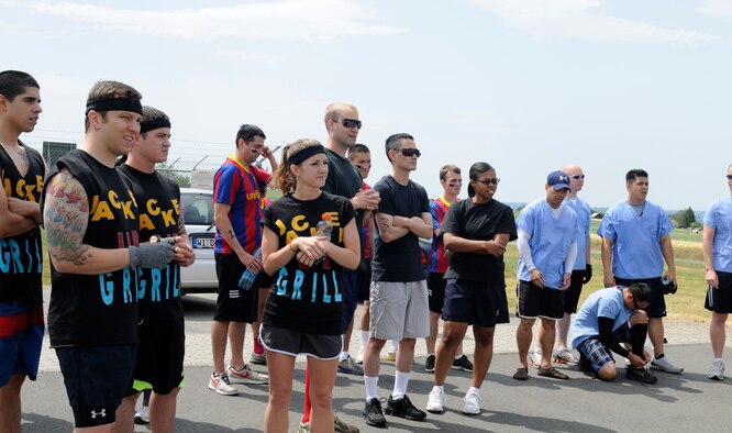 SPANGDAHLEM AIR BASE, Germany – Competitors wait to begin the Saber Endurance Challenge here June 3. Teams of five were judged on team creativity, guessing their time and money raised. Students from Bitburg High School guessed their time closest within four minutes of estimated completion. Team Soup Kitchen from the 52nd Equipment Maintenance Squadron was awarded most creative, and Team MDSS from the 52nd Medical Group raised the most money. The challenge was hosted by the Tier II council and raised money for the Wounded Warrior Project at Landstuhl Regional Medical Center, Germany.  (U.S. Air Force photo/Airman 1st Class Brittney Frees)