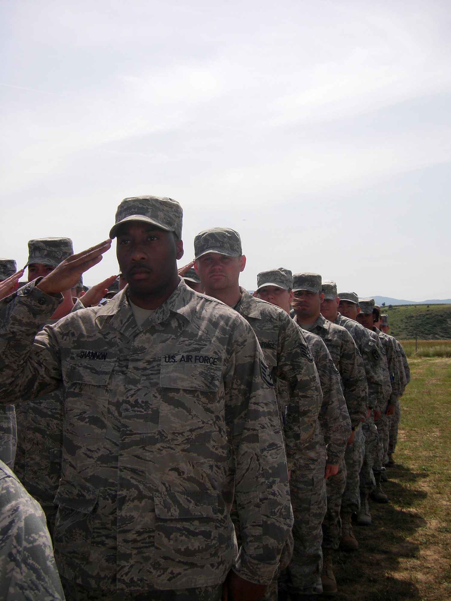 CAMP PEPELISHTE, Macedonia -- Members of the United States Air Force and Army salute during the Macedonian and American National Anthems at the opening ceremony of Medical Training Exercise in Central and Eastern Europe 2011 here June 6.  The countries participating in this year’s MEDCEUR are Macedonia, Montenegro, Bosnia and Herzegovina, Serbia, Slovenia, Norway and the United States.  MEDCEUR is a Partnership for Peace and Chairman of the Joint Chiefs of Staff-sponsored regional and multilateral exercise in Central and Eastern Europe designed to provide medical training and operational experience in a deployed environment.  (U.S. Air Force photo/Master Sgt. Kelley J. Stewart)