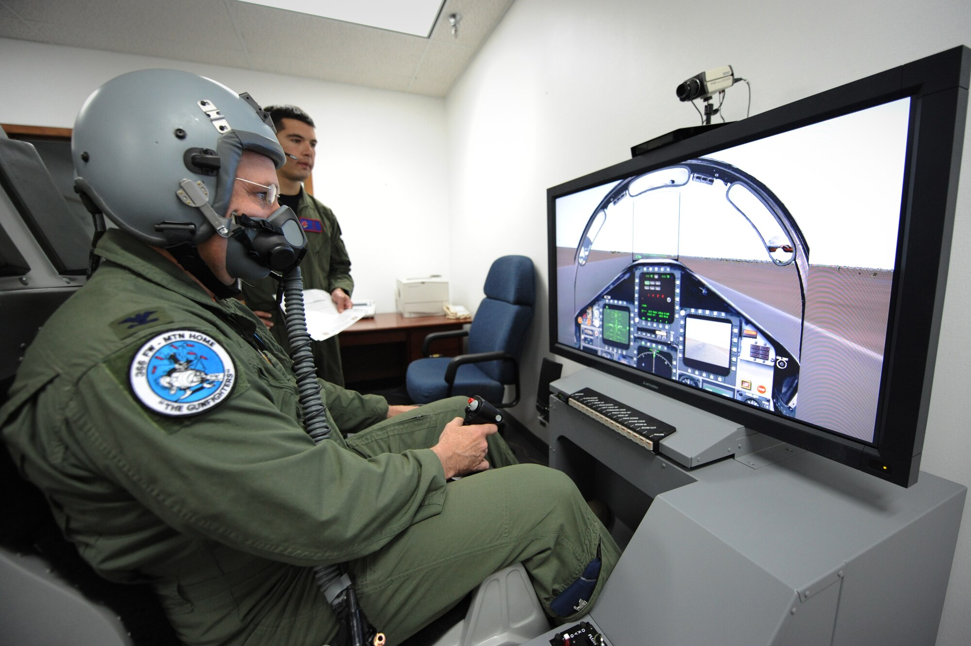 MOUNTAIN HOME AIR FORCE BASE, Idaho – Col. Ron Buckley, 366th Fighter Wing commander, flies a simulated scenario on the Reduced Oxygen Breathing Device here June 6. Hypoxia recognition training must be completed every five years. (U.S. Air Force photo by Staff Sgt. Gina Chiaverotti-Paige)