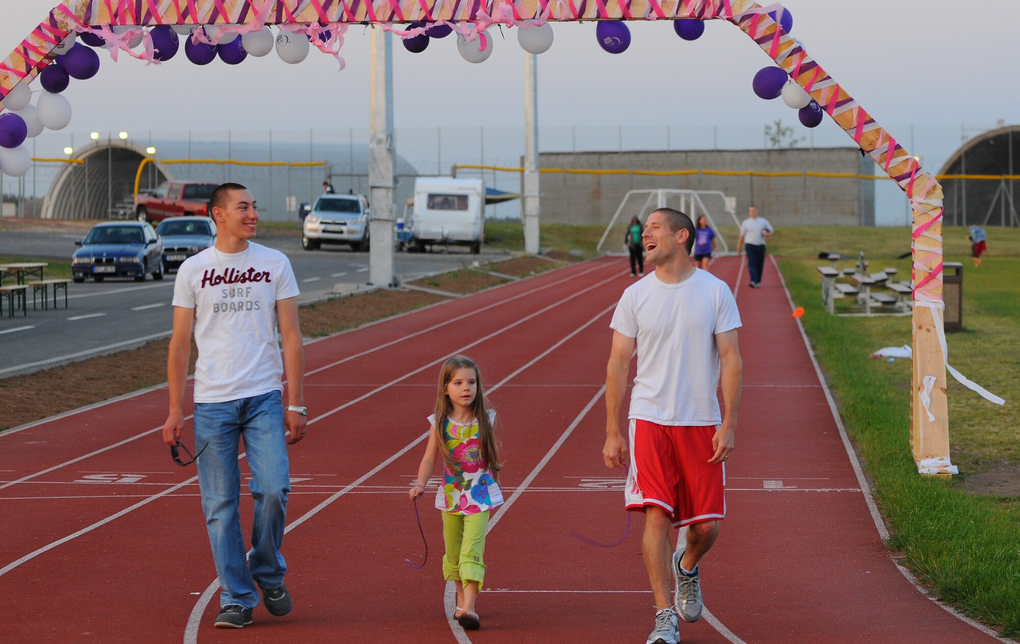 SPANGDAHLEM AIR BASE, Germany – Airmen and family members make small talk as they walk around the base track during the Relay for Life 24-hour fundraising event here June 3. The Relay for Life fundraiser had 137 supporters participate in the event and raised $1,319.85 for the American Cancer Society.  (U.S. Air Force photo/Airman 1st Class Dillon Davis)