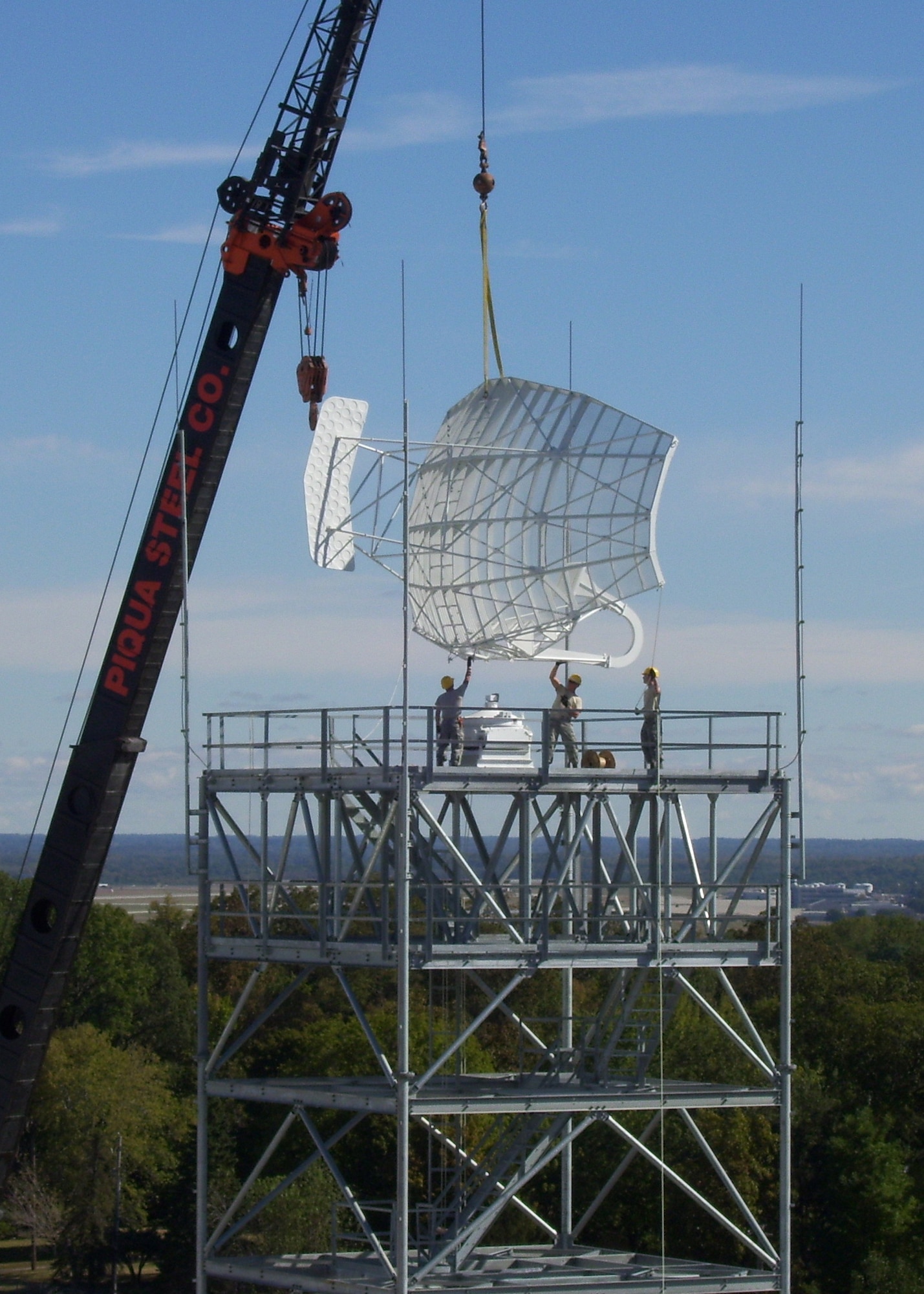 Airmen place a radar atop a new tower at Wright-Patterson Air Force Base, Ohio in this September 2010 photo. BRAC-directed relocation of four Air Force Research Laboratory research radar systems from Rome N.Y. to Wright-Patterson is now nearly complete. Air National Guard and active duty engineering installation squadron personnel and active duty RED HORSE squadron engineers teamed to perform the installation for millions of dollars less than contractor estimates for the project. (U.S. Air Force photo)