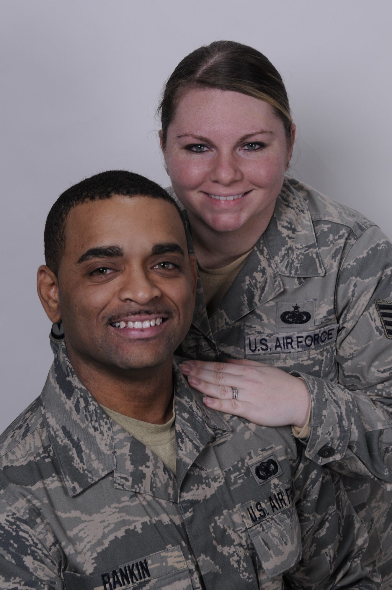 Staff Sgt. Christopher L. Rankin, a security forces specialist with the 130th Security Forces Squadron, 130th Airlift Wing, West Virginia Air National Guard, Charleston, W.Va. and his wife, Staff Sgt. Pauline Rankin, a supply technician with the 130th Logistics Squadron pose for a portrait in the 130th AW Public Affairs photography studio, Jan. 9. The staff sergeants joined the unit, Jan. 8, 2011. 

Staff Sgt. Christopher L. Rankin, a native of Huntington, W.Va., who separated from the 130th SFS in November 2007, to be with his wife, a native of Greenoch, Scotland, who was on active duty at RAF Mildenhall in Suffolk, England at the time, said he’s happy to be back in uniform. 

The staff sgts. come to the unit from Fort Riley, Kansas, where Staff Sgt. Pauline Rankin was stationed as a supply liaison for a Tactical Air Control Party unit assigned to the 10th Air Support Operations Squadron. 

Staff Sgt. Christopher L. Rankin will complete security forces refresher training and weapons requalification at the unit. The staff sergeants have been married for four years. 

