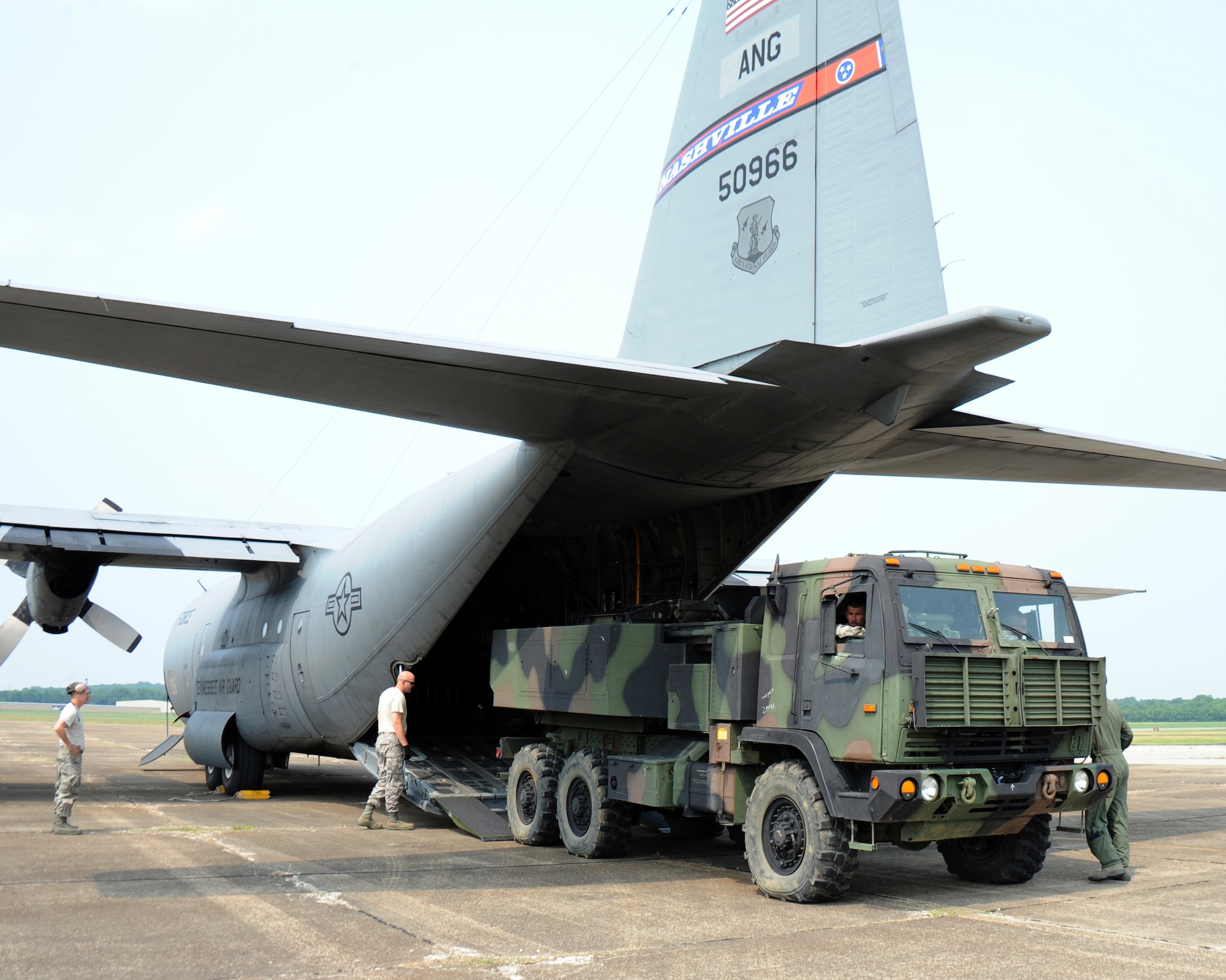 A High Mobility Artillery Rocket System (HIMARS) vehicle is loaded into one of four C-130 aircraft from the 118th Airlift Wing June 4, 2011 as the Tennessee Army National Guard's 1/181st Field Artillery Battalion headed to Fort Chaffee, Ark. for two weeks of annual training.