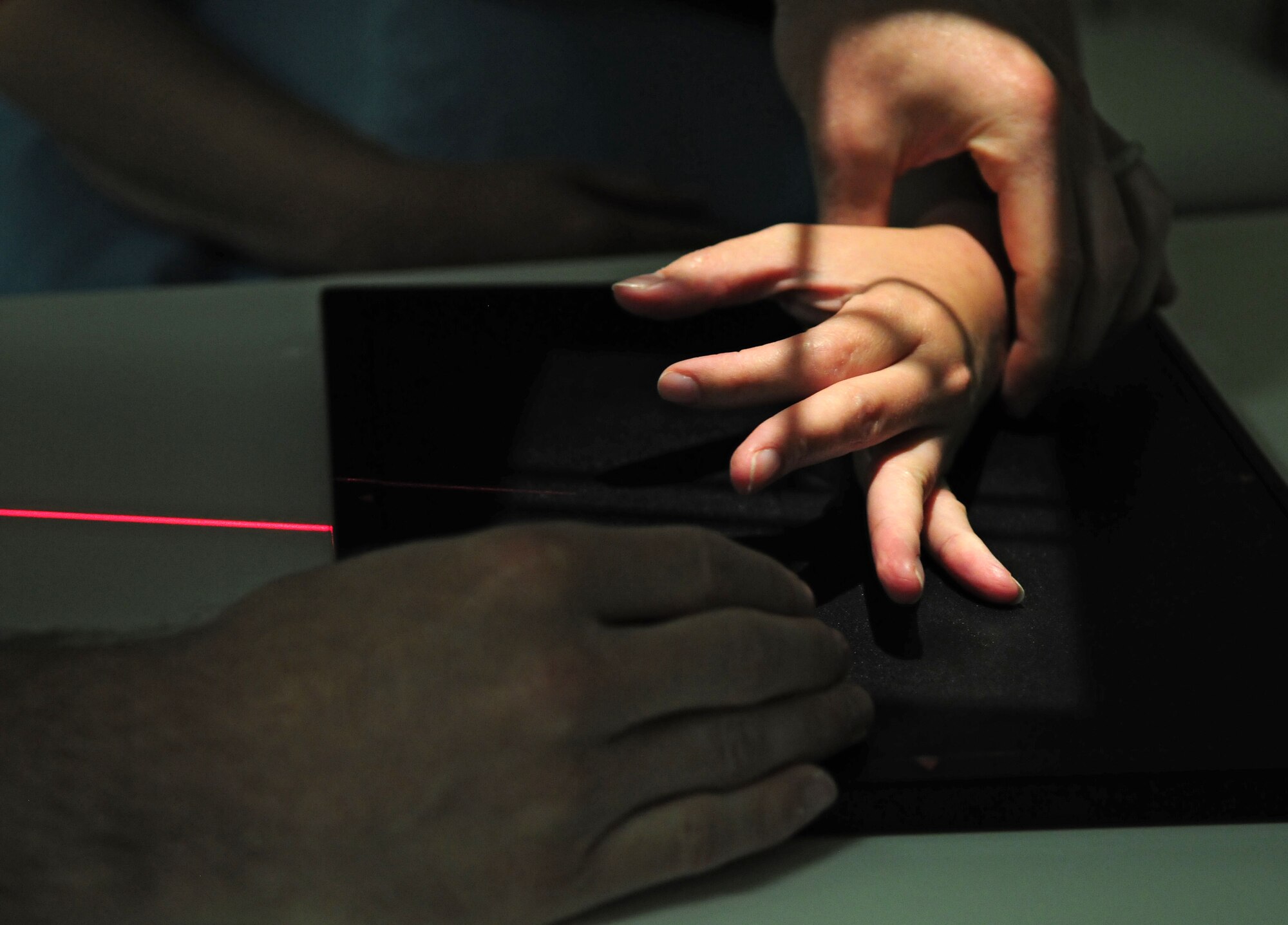 SPANGDAHLEM AIR BASE, Germany – A 52nd Medical Support Squadron ultrasound technician positions a patient’s hand before taking an X-ray here June 2. The X-ray will aid the physicians in diagnosing medical conditions the patient may have. (U.S. Air Force photo/Airman 1st Class Matthew B. Fredericks)