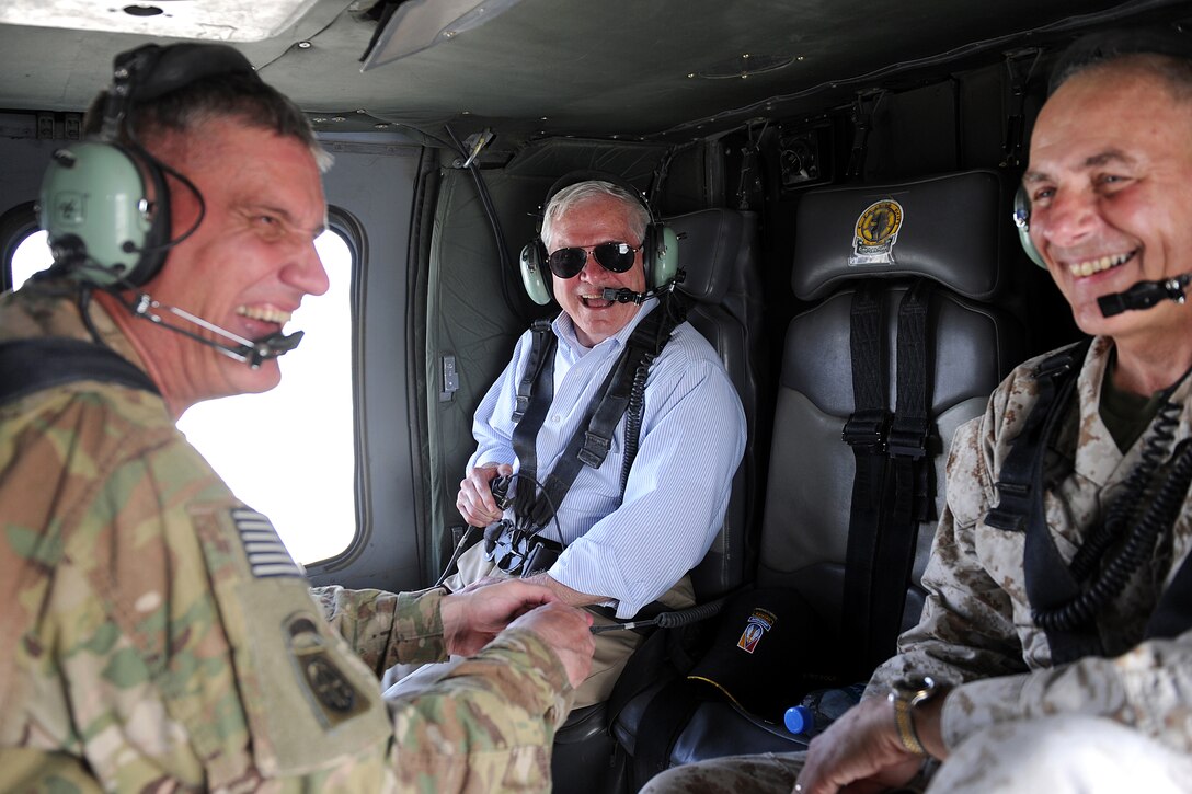 U.S. Defense Secretary Robert M. Gates shares a laugh with U.S. Army Lt. Gen. David Rodriguez, left, and U.S. Army Lt. Gen. John Kelley on a UH-60 Black Hawk helicopter over Afghanistan, June 6, 2011.