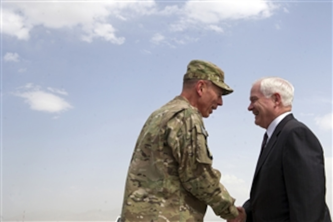 Secretary of Defense Robert M. Gates is greeted by Commander of ISAF Gen. David Petraeus after his arrival in Kabul, Afghanistan, on June 4, 2011.   