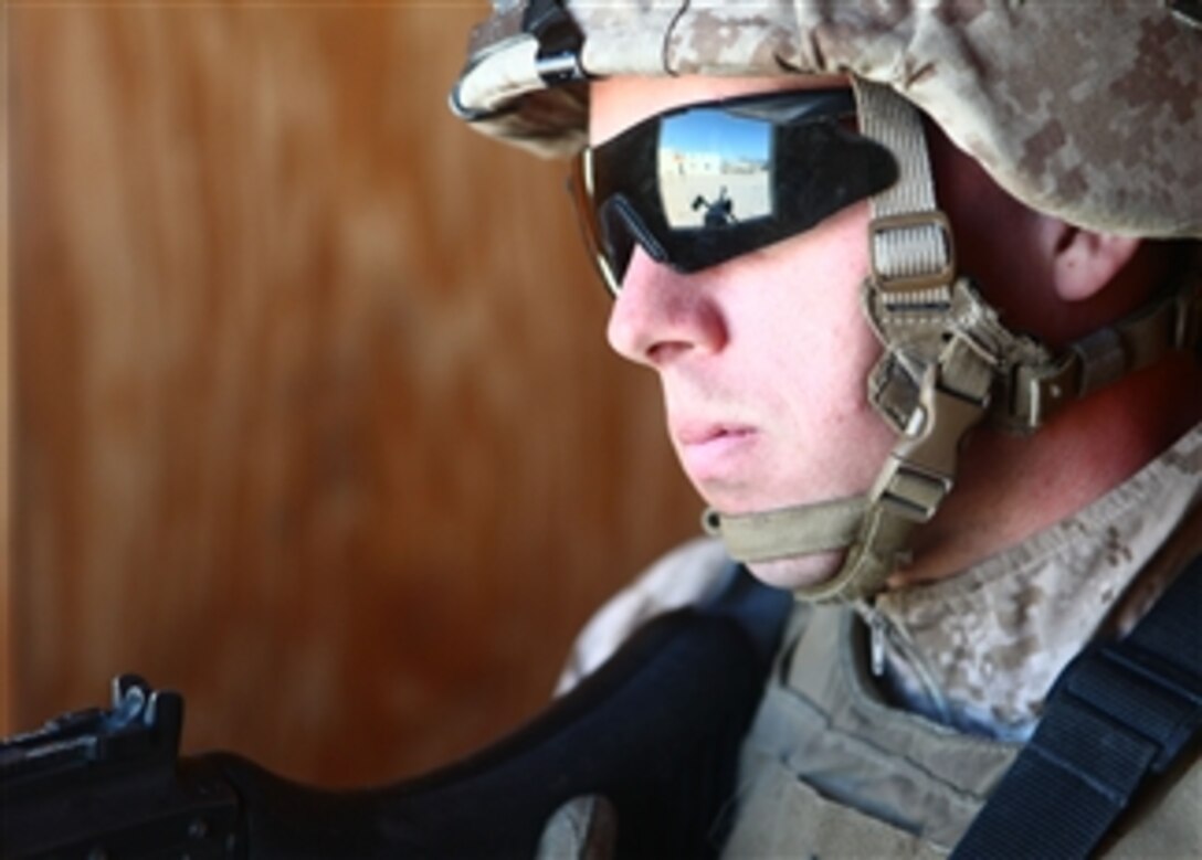 A Marine stands guard near the site of the Marine Battalion