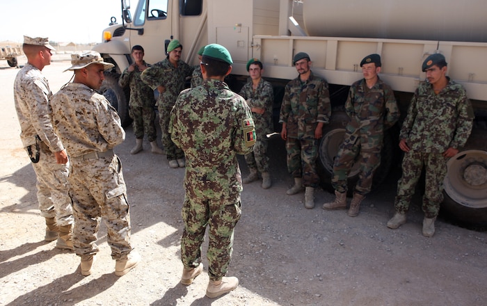 Soldiers with the 215th Corps Logistics Battalion, Afghan National Army participate in a basic radio operator course led by ANA Sgt. Khair Mohammad, a basic radio operator instructor, June 7, 2011, at Camp Shorabak, Afghanistan.  This portion of the curriculum was the final test of a week-long radio operator instructor course taught by Marines with the Embedded Partnering Team, 2nd Maintenance Battalion, 2nd Marine Logistics Group (Forward).  Khair is one out of six soldiers to graduate from the course and is now capable of teaching his fellow ANA soldiers basic radio operations.