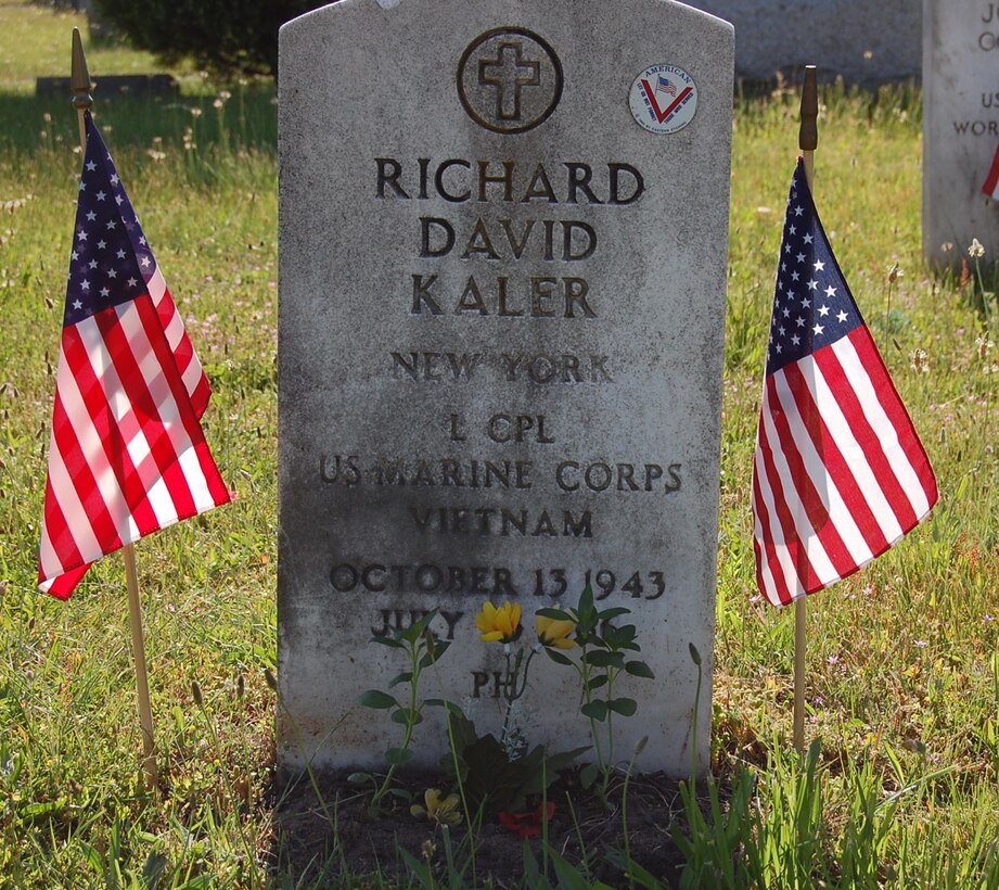 The headstone at the grave of Lance Cpl. Richard David Kaler, a machine gunner with Hotel Company, 2nd Battalion, 4th Marine Regiment, 3rd Marine Division (Reinforced), Fleet Marine Force, who was killed in action near Cam Lo, Republic of Vietnam, on July 21, 1966 shows he received the Purple Heart.  Kaler, a Patchogue native, recieved the Navy Cross as well and a local recruiter is working with other veterans and community members to get a headstone that shows both decorations.