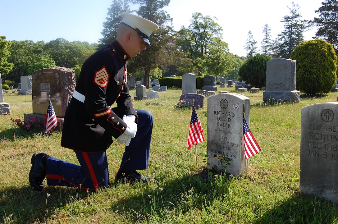 Staff Sgt. John Gallagher pays his respects to Patchogue native and Navy Cross recipient Lance Cpl. Richard David Kaler, a machine gunner with Hotel Company, 2nd Battalion, 4th Marine Regiment, 3rd Marine Division (Reinforced), Fleet Marine Force, who was killed in action near Cam Lo, Republic of Vietnam, on July 21, 1966.  Gallagher is a recruiter at Recruiting Substation Patchogue, Recruiting Station New York, 1st Marine Corps District.