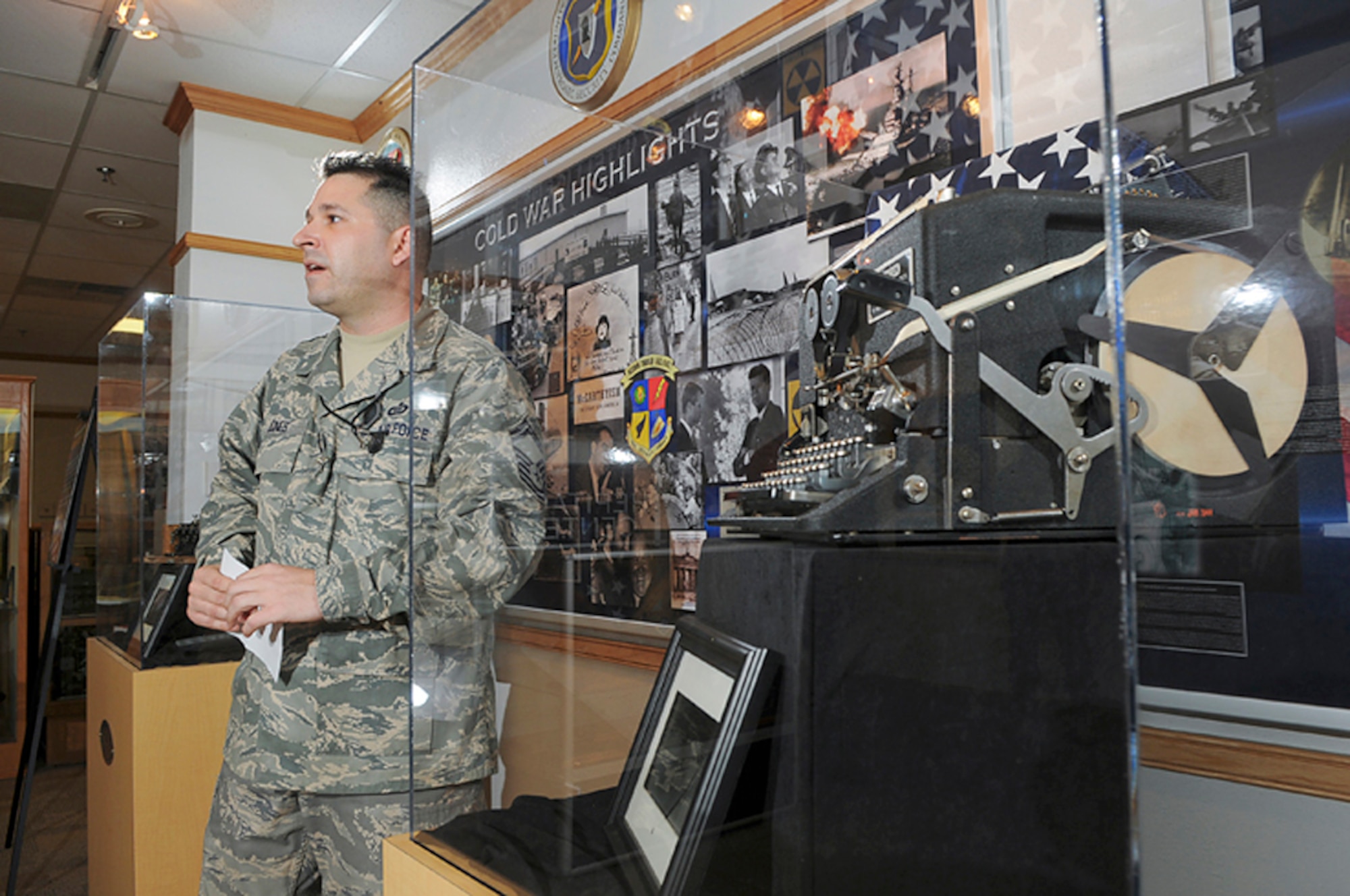 Senior Master Sgt. Benjamin Jones from the Air Force Intelligence Surveillance and Reconnaissance Agency History Office explains the intricacies of the World War II era Sigaba cryptologic machine displayed in the Agency's Heritage Center. (Courtesy photo/William Belcher) 