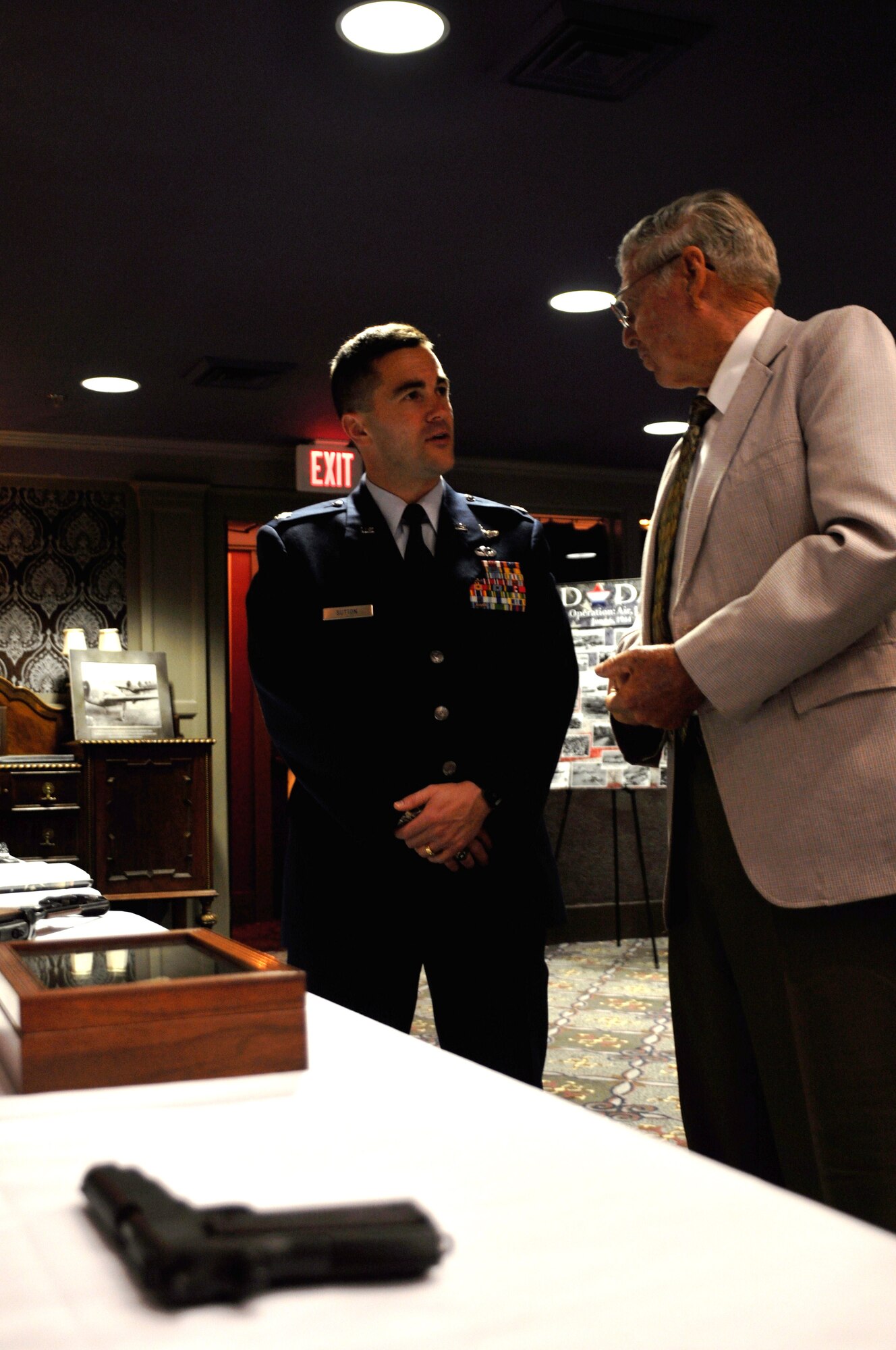 Lt. Col. Kevin Sutton listens to D-Day veteran Joe Johnson as he recounts a war story at the West Point Ritz Theater on June 4. Mr. Johnson came ashore on the beaches of Normandy in the 5th wave not even a week after he turned 17. (U.S. Air Force photo/Airman 1st Class Chase Hedrick)