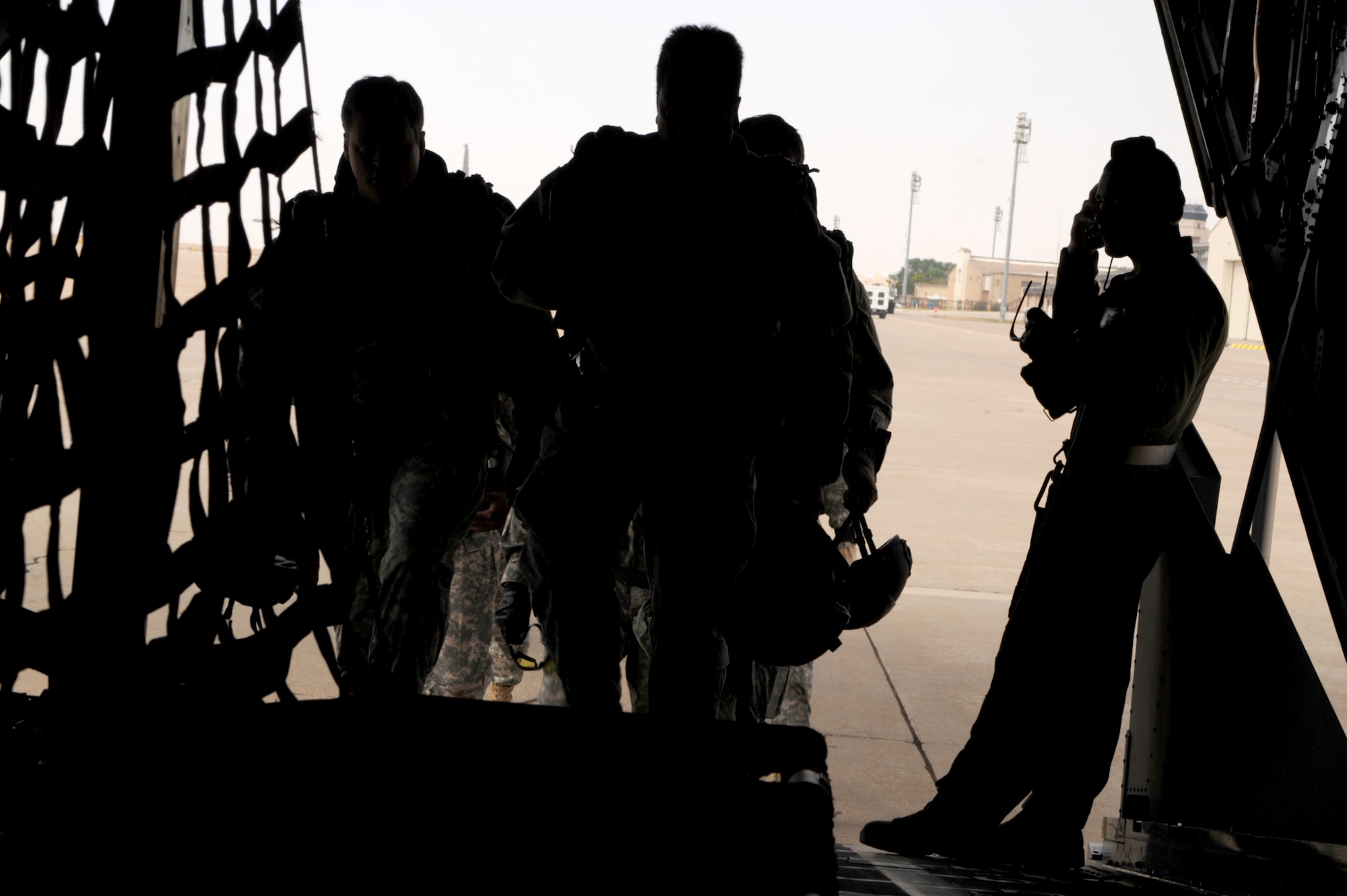 Special operations forces enter a MC-130W Dragon Spear flown by the 73rd Special Operations Squadron at Cannon Air Force Base, N.M., before the 27th Special Operations Wing Capabilities Exercise, June 4, 2011.  Parachutists were one of many aerial and ground attractions of the CAPEX, which is an annual exhibition of the 27 SOW's many special operations aircraft and missions for Cannon Airmen and their families.  (U.S. Air Force photo by Senior Airman James Bell)(RELEASED)