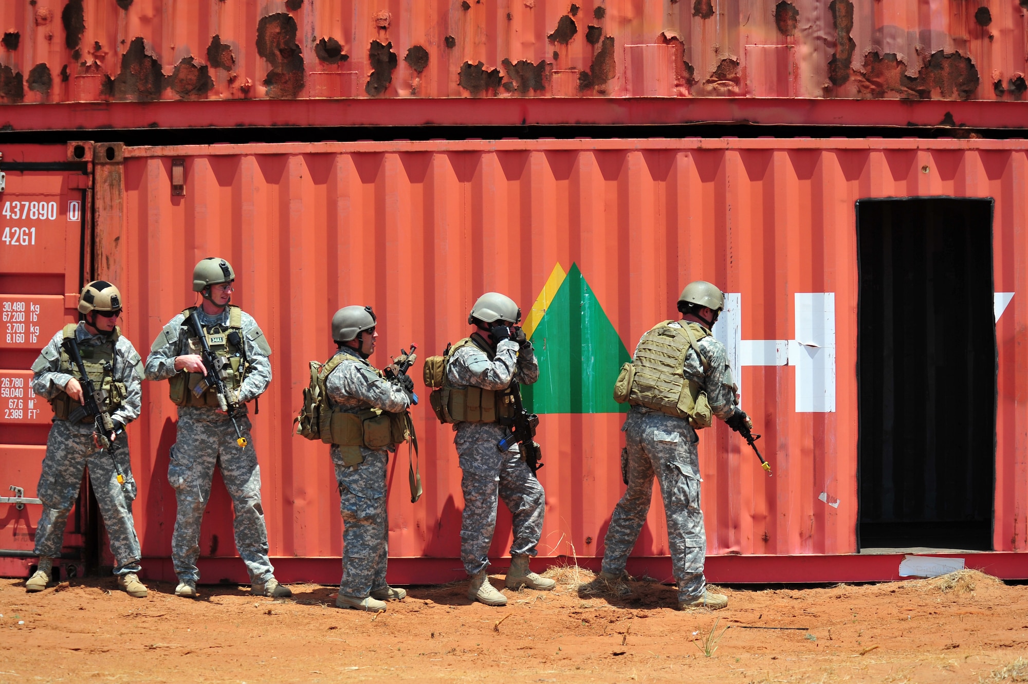 Special operations forces prepare to conduct a simulated breach and clear maneuver as part of an aerial and ground demonstration at the 27th Special Operations Wing Capabilities Exercise, June 4, 2011, at Melrose Air Force Range. The CAPEX is an annual exhibition of the 27 SOW's many special operations aircraft and missions for Cannon Airmen and their families. (U.S. Air Force photo by Tech. Sgt. Josef Cole)(RELEASED)