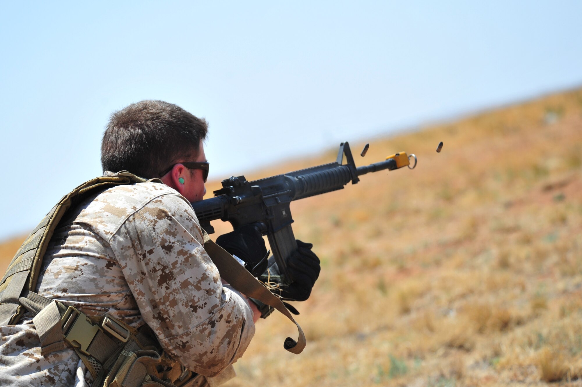A volunteers poses as the opposition force as part of an aerial and ground demonstration for around 600 spectators at the 27th Special Operations Wing Capabilities Exercise, June 4, 2011, at Melrose Air Force Range. The CAPEX is an annual exhibition of the 27 SOW's many special operations aircraft and missions for Cannon Airmen and their families. (U.S. Air Force photo by Tech. Sgt. Josef Cole)(RELEASED)