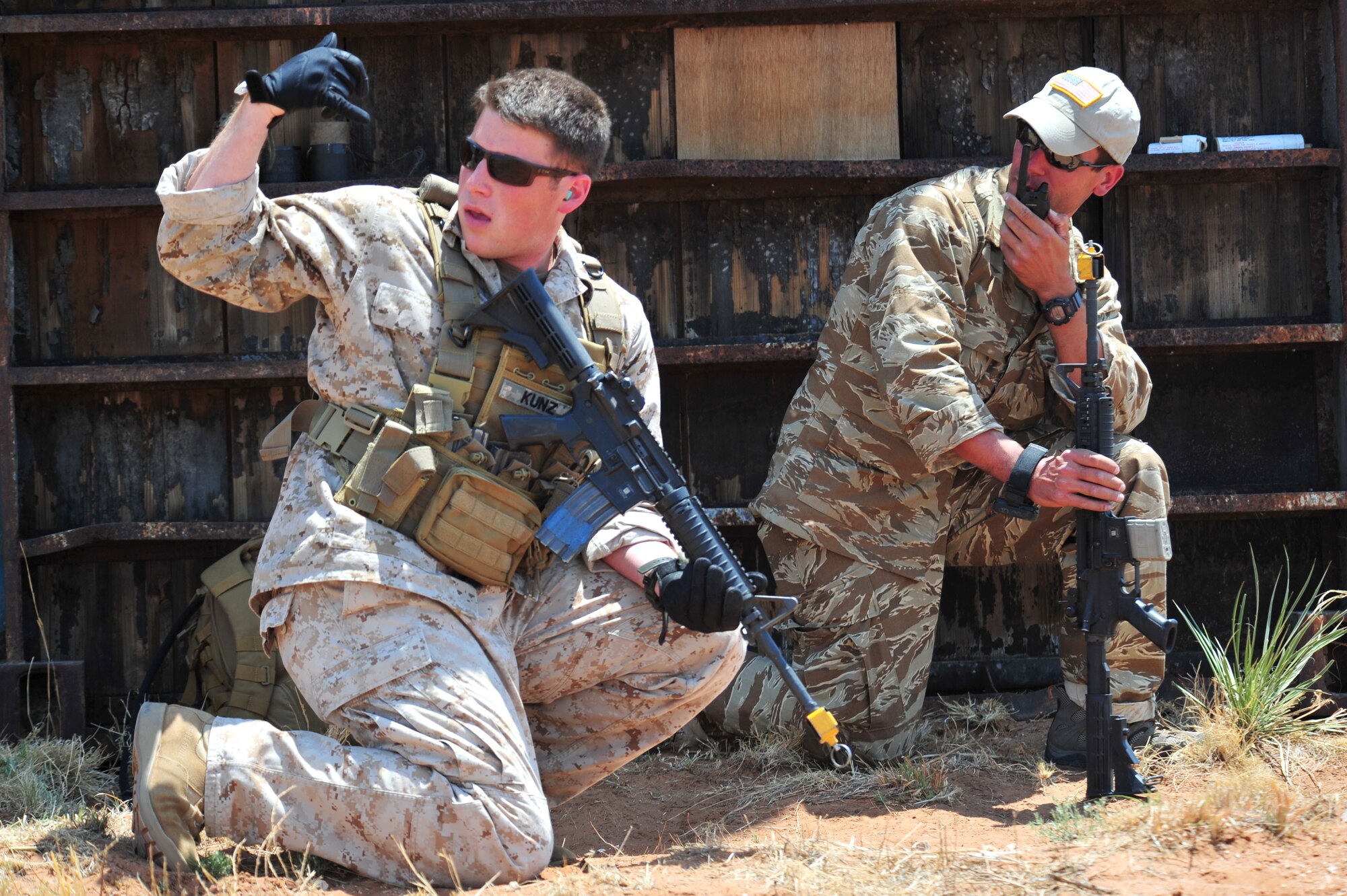 Volunteers pose as opposition forces as part of an aerial and ground demonstration for around 600 spectators at the 27th Special Operations Wing Capabilities Exercise, June 4, 2011, at Melrose Air Force Range. The CAPEX is an annual exhibition of the 27 SOW's many special operations aircraft and missions for Cannon Airmen and their families. (U.S. Air Force photo by Tech. Sgt. Josef Cole)(RELEASED)