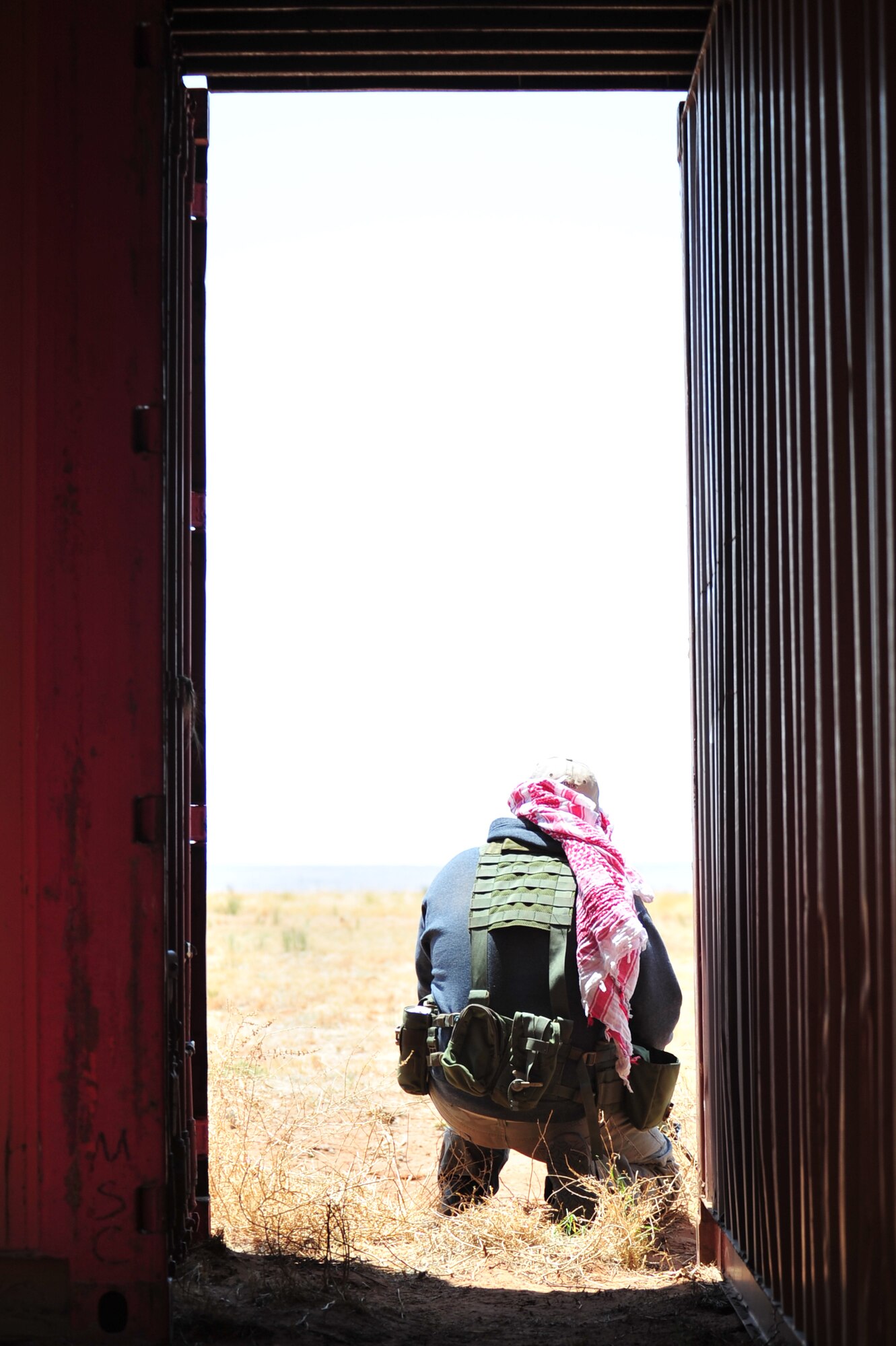 A volunteer poses as the opposition force as part of an aerial and ground demonstration for around 600 spectators at the 27th Special Operations Wing Capabilities Exercise, June 4, 2011, at Melrose Air Force Range. The CAPEX is an annual exhibition of the 27 SOW's many special operations aircraft and missions for Cannon Airmen and their families. (U.S. Air Force photo by Tech. Sgt. Josef Cole)(RELEASED)