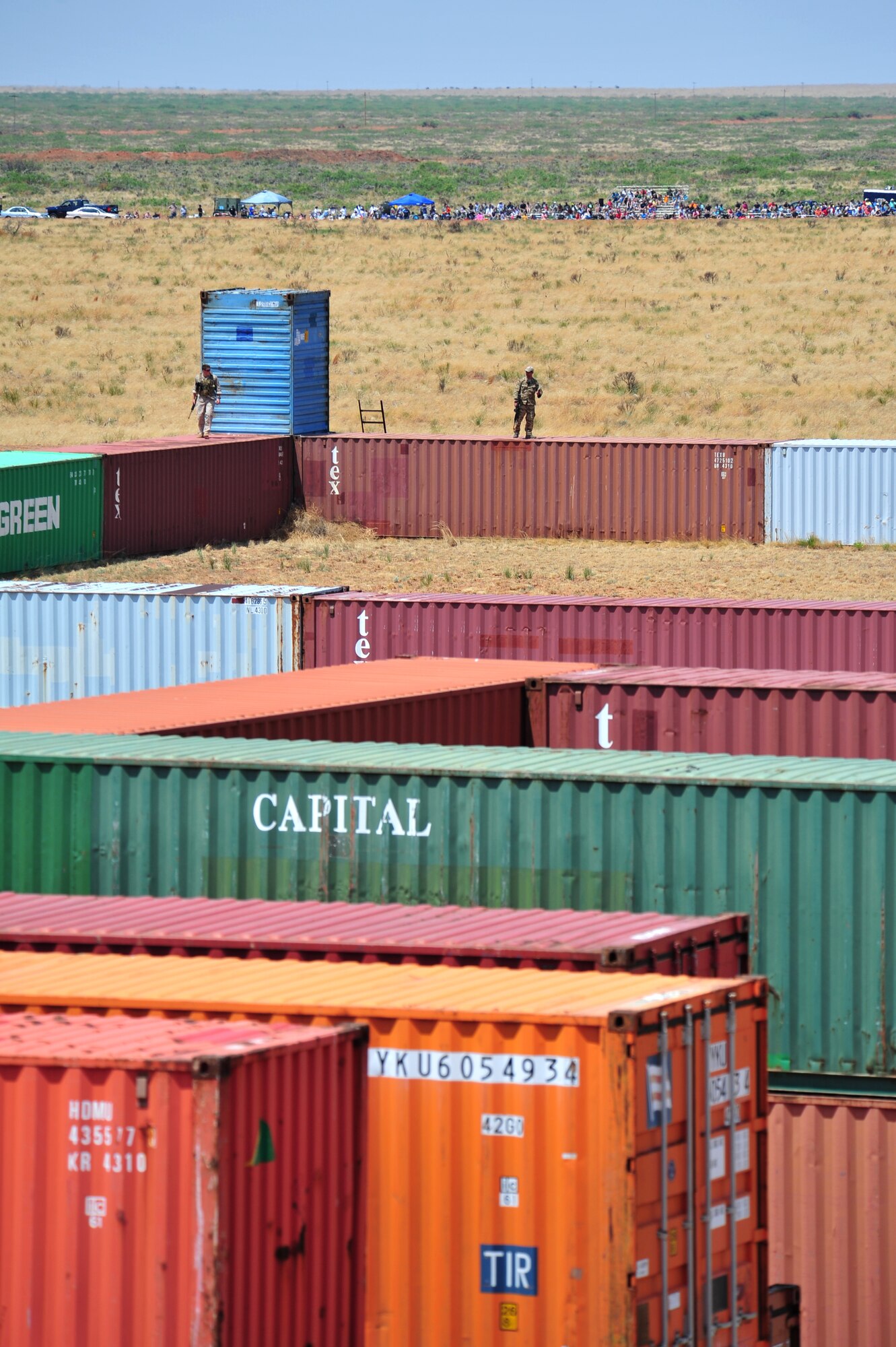 Volunteers pose as opposition forces as part of an aerial and ground demonstration for around 600 spectators at the 27th Special Operations Wing Capabilities Exercise, June 4, 2011, at Melrose Air Force Range. The CAPEX is an annual exhibition of the 27 SOW's many special operations aircraft and missions for Cannon Airmen and their families. (U.S. Air Force photo by Tech. Sgt. Josef Cole)(RELEASED)