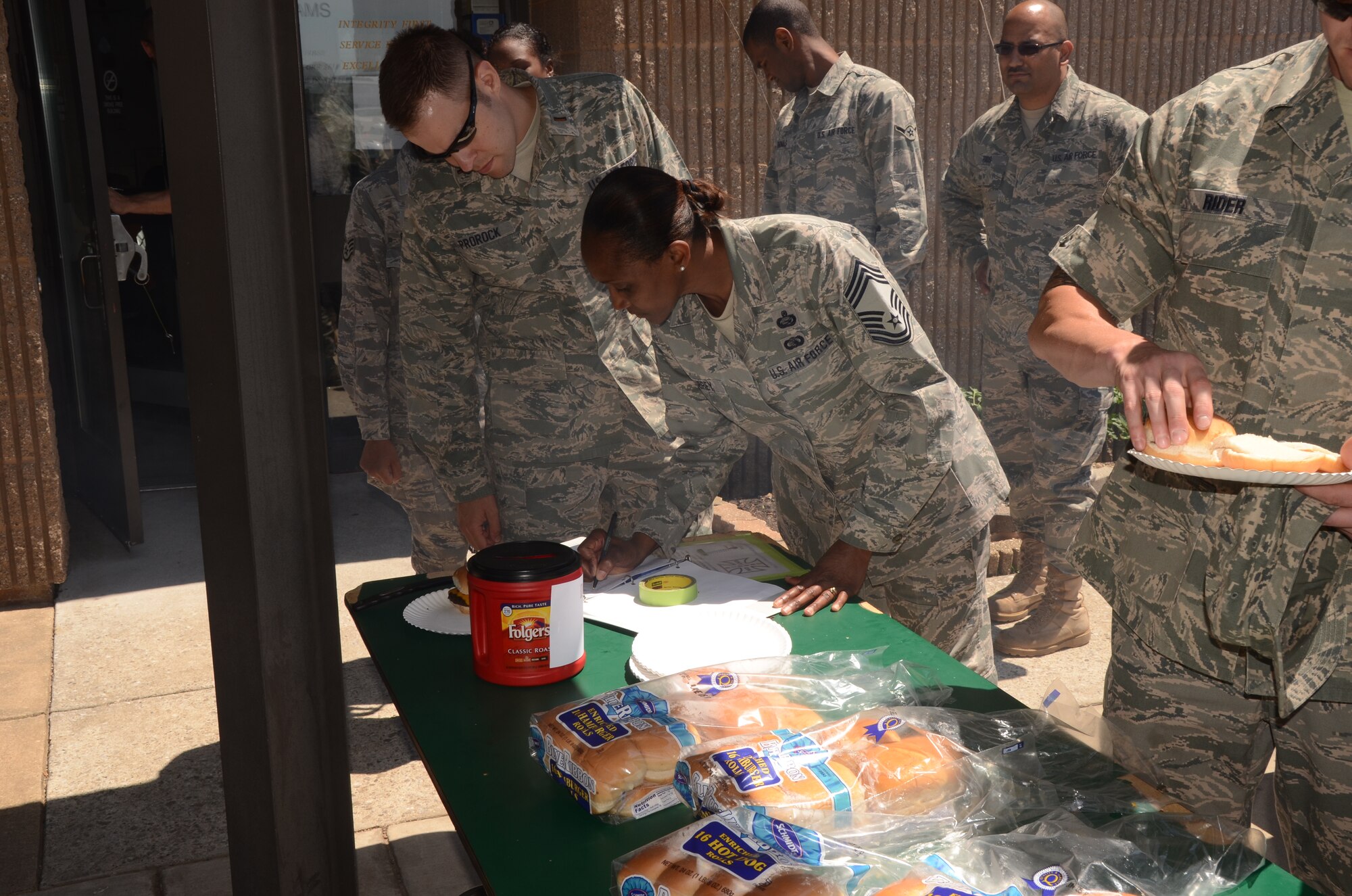 Chief Master Sgt. Phyllis Aubrey and 2nd Lt. Mark Prorock, from the Force Support Squadron station at the 175th Wing at Warfield Air National Guard Base in Baltimore, Md., June 3, 2011 had invited thier entire section to the charity cookout to benefit the Ride Across Maryland which funds breast cancer research. The cookout rasied over $600. (U.S. Air Force photo by Master Sgt. Ed Bard/Released)