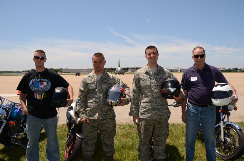 (Left to right) Tech. Sgt. Brandon Helt, Tech. Sgt. Matthew Shortridge, Staff Sgt David Deutsch and retired Lt. Col. Butch Hensel, stand with their motorcycles on the flight line at the Maryland Air National Guard, 175th Wing at Warfield Air National Guard Base in Baltimore, Md., June 3, 2011. They are ready to ride 150 miles in the Ride Across Maryland to benefit breast cancer. (U.S. Air Force photo by Master Sgt. Ed Bard/Released)
