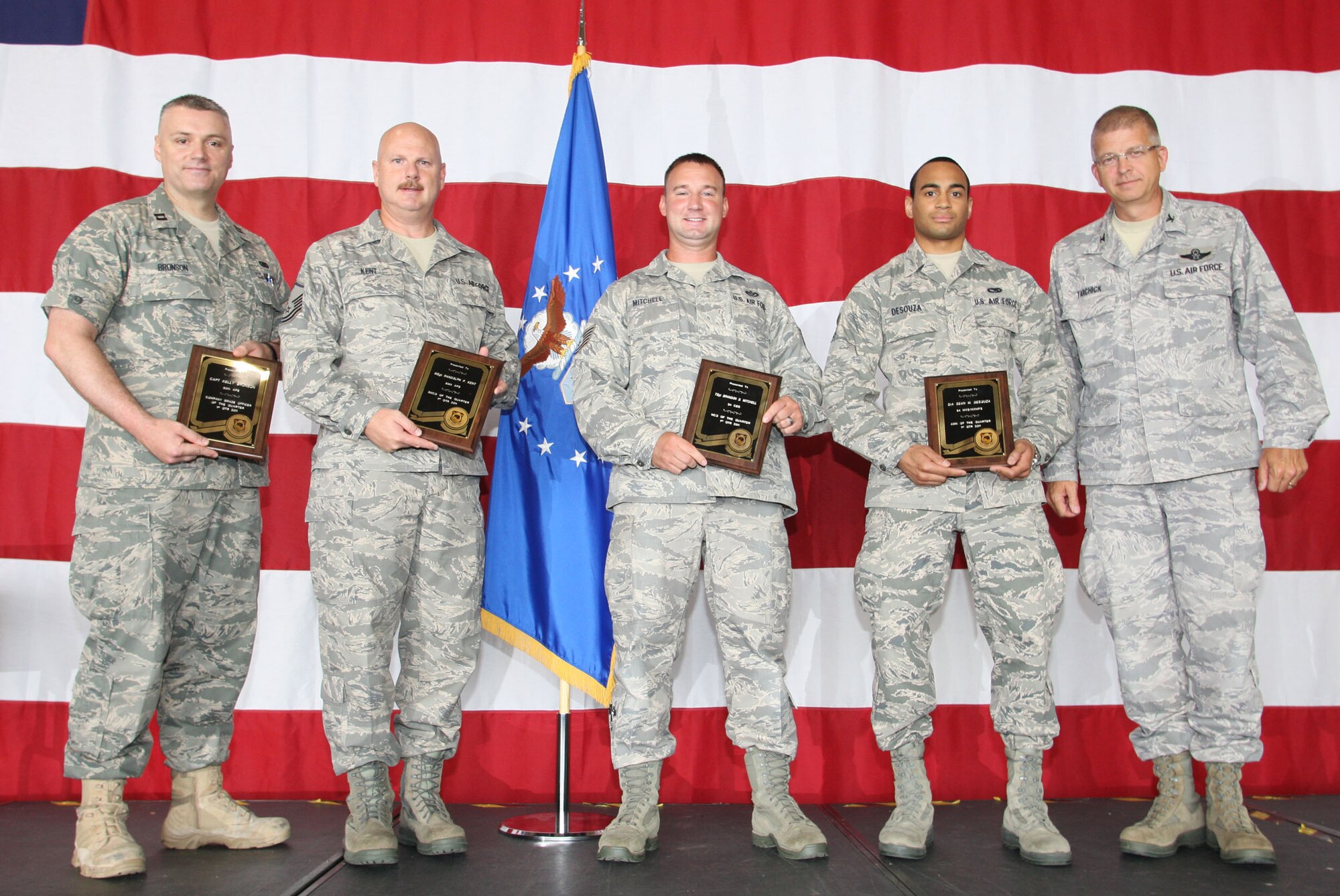 The 94th Airlift Wing First Quarter Award Winners are from left to right, Capt. Kelly Bronson, 80th Aerial Port Squadron, Master Sgt. Randolph P. Kent, 80th Aerial Port Squadron, Tech. Sgt. Brandon D. Mitchell, 94th Civil Engineer Squadron, and Senior Airman Sean M. Desouza, 94th Maintenance Squadron. (U.S. Air Force Photo/Don Peek)