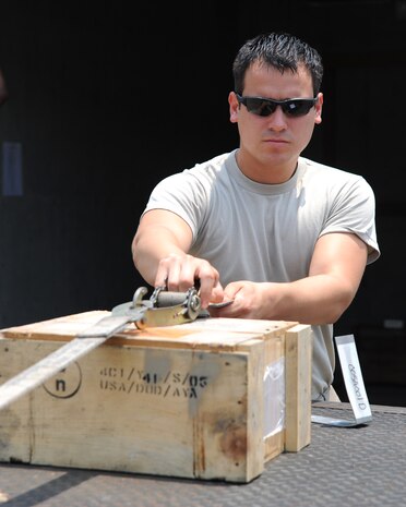 Senior Airman Rafael Ramirez secures demolition charges for transportation on Joint Base Charleston June 2, 2011. Securing the explosives for transportation is a requirement to ensure safety. Airman Ramirez is from the 437th Maintenance Squadron's Munitions Shop.  (U.S. Air Force photo/ Staff Sgt. Nicole Mickle)  